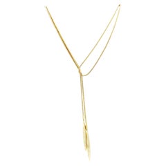 Tiffany & Co. Collier lariat en or 18 carats avec chaîne en forme de serpent à double plume