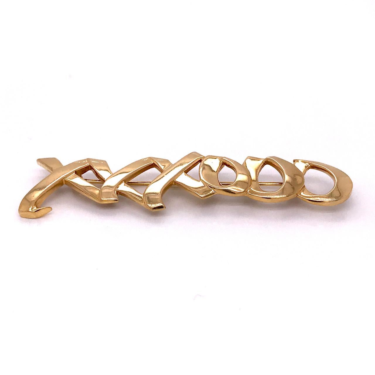 A very fine Graffiti Love & Kisses brooch by Paloma Picasso for Tiffany & Co.

In 18k yellow gold with the XXXOOO love and kisses motif.

Simply top shelf design by the world's premier retailer!

Marked 750 for 18k gold fineness, Tiffany & Co., and