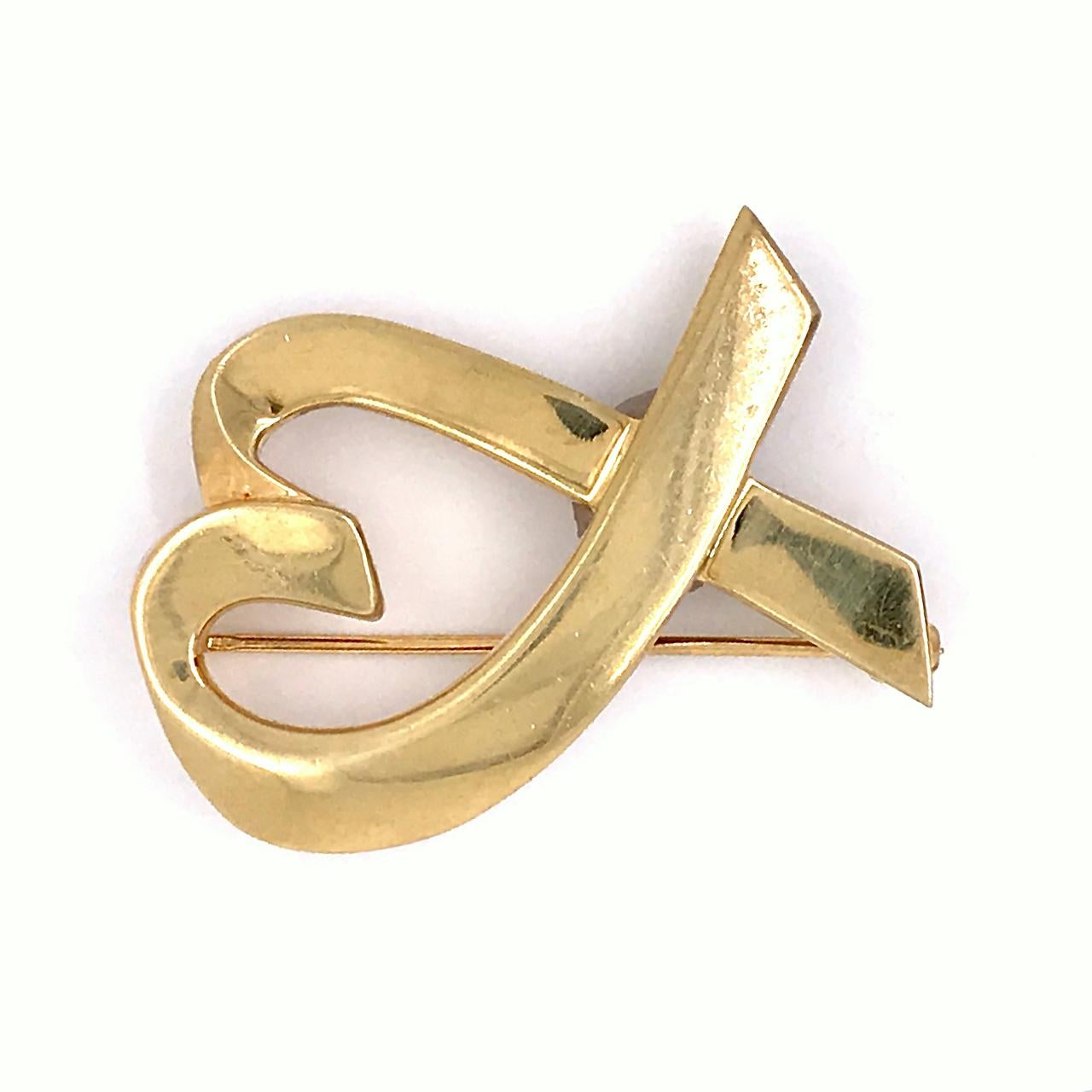 A very fine Tiffany & Co. Loving Heart brooch by Paloma Picasso.

In 18K gold.

Marked to the reverse: 750 for 18k gold fineness and Tiffany & Co. 

A soon to be iconic brooch from one of Tiffany's most renowned designers!

Height: ca. 33 mm
Width: