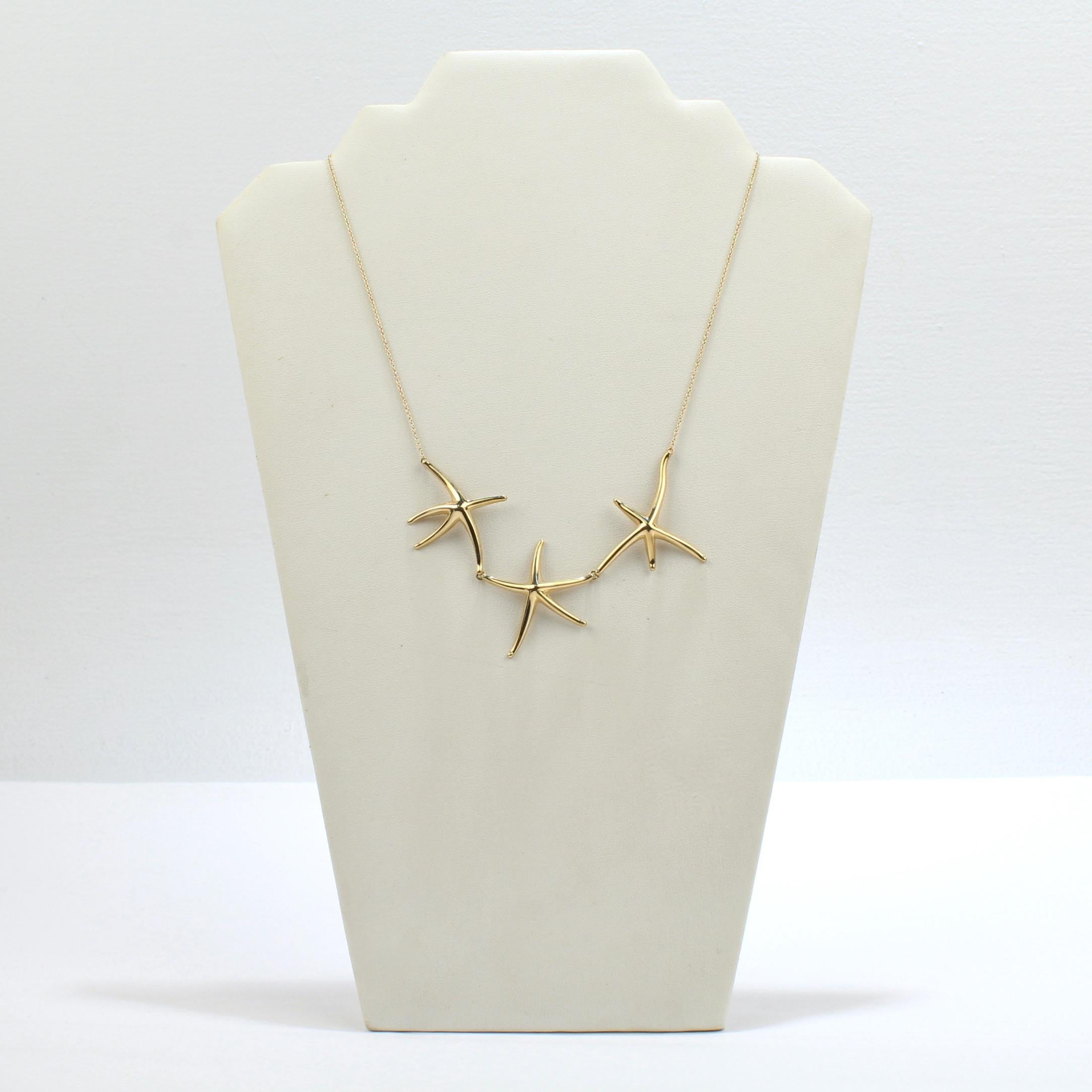 A very fine Tiffany & Co gold Starfish necklace.

Designed by Elsa Peretti.

With three 18k gold star fish linked together and suspended at the enter of a gold cable chain.

Great Tiffany style from a great designer!

Date:
20th Century

Overall