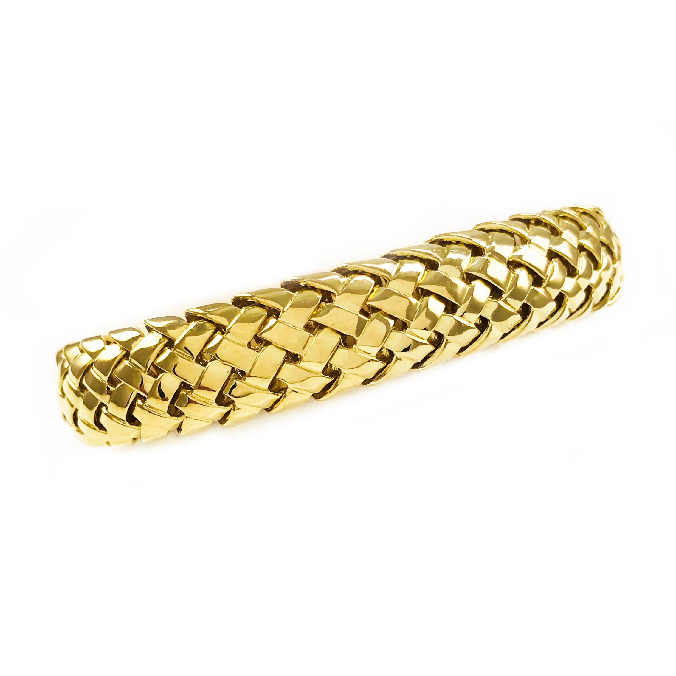 Tiffany & Co. 18 Karat Yellow Gold Vannerie Bracelet. Lovely heavyweight basket weave bracelet with clasp closure. Stamped on the inside clasp is Tiffany & Co. 750 © 1995.  7 inches in length. 