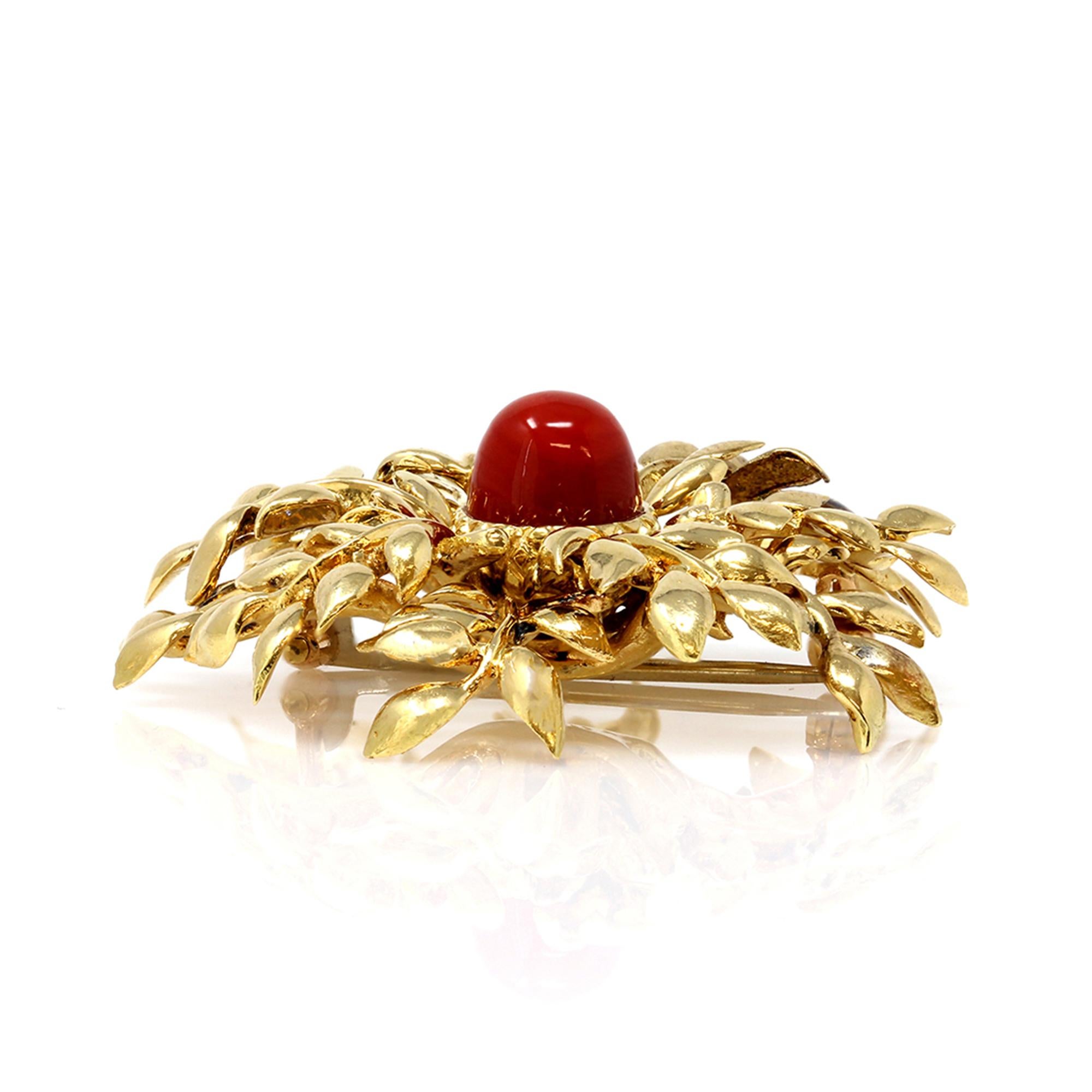 red and gold brooch
