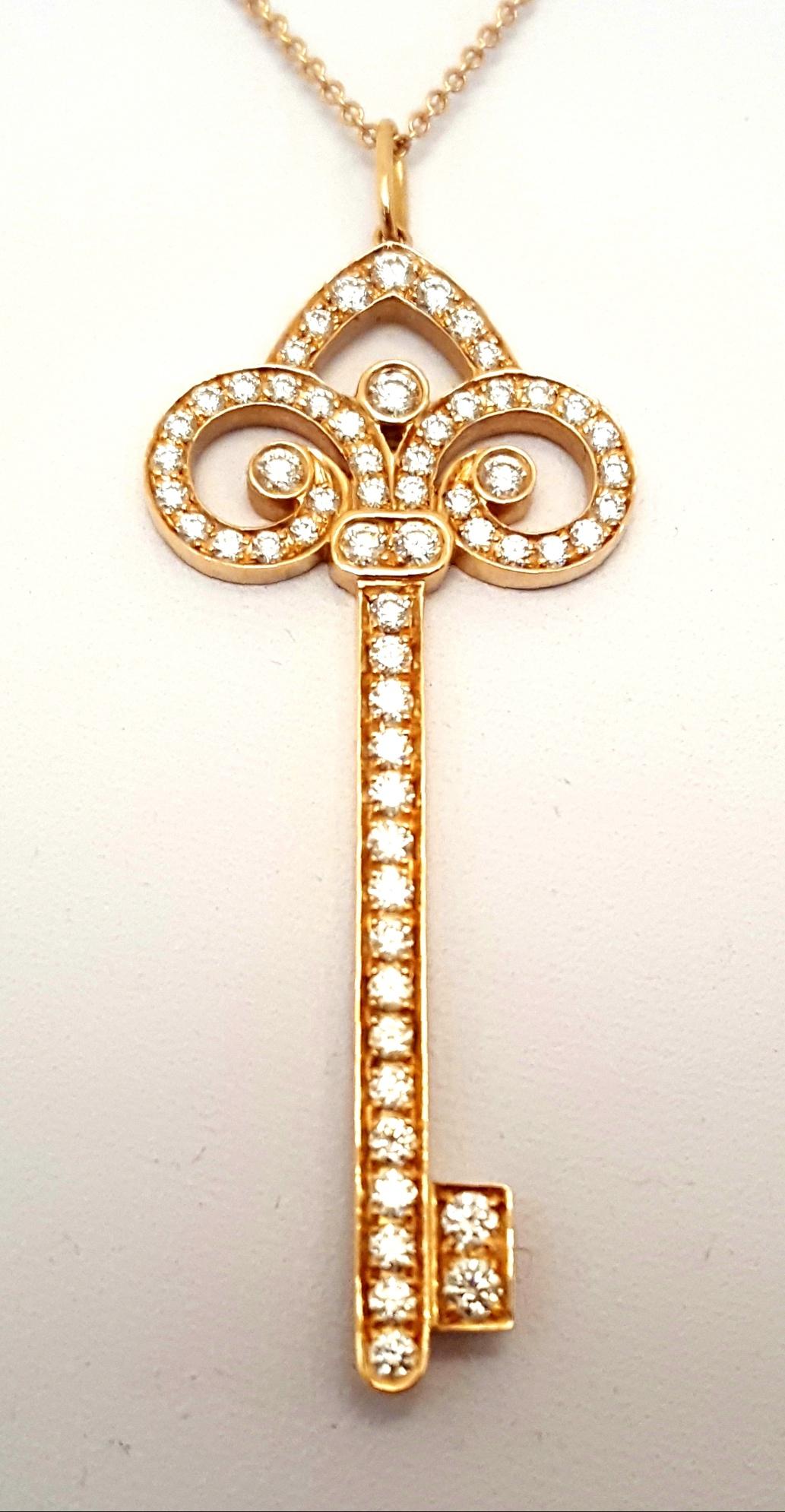 Tiffany & Co. 18 Karat Rose Gold Diamond Fleur-de-Lis Diamond Key Necklace In Excellent Condition For Sale In Palm Beach, FL