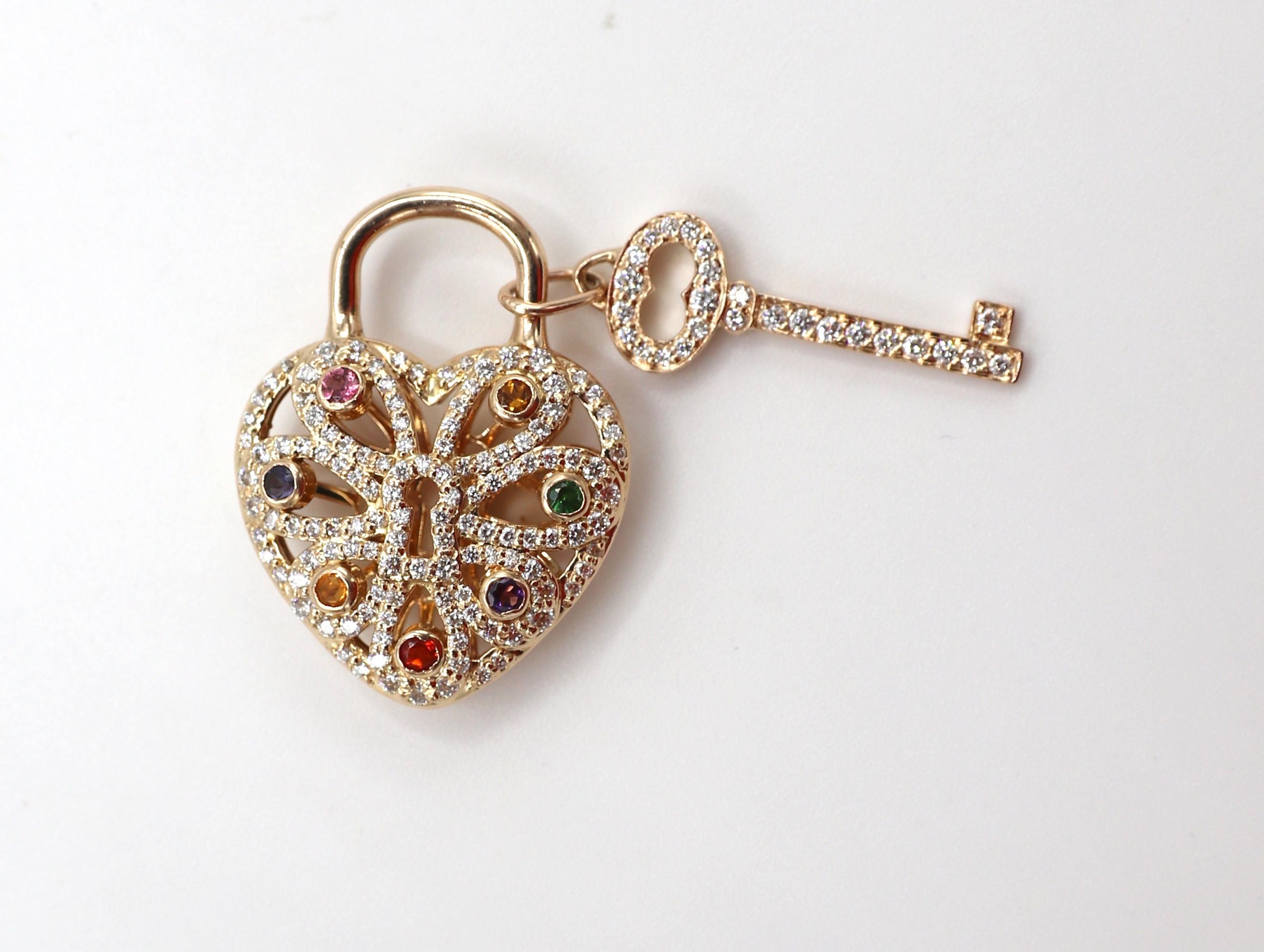 Tiffany & Co. 18 Karat Rose Gold Diamond Multi Gemstone Heart & Key Pendant 
Metal: 18 Karat rose gold
Weight: 7.82 grams
Diamonds: Approx. .75 CTW G VS round diamonds 
Length: 1 inch
Note: Does not include chain
