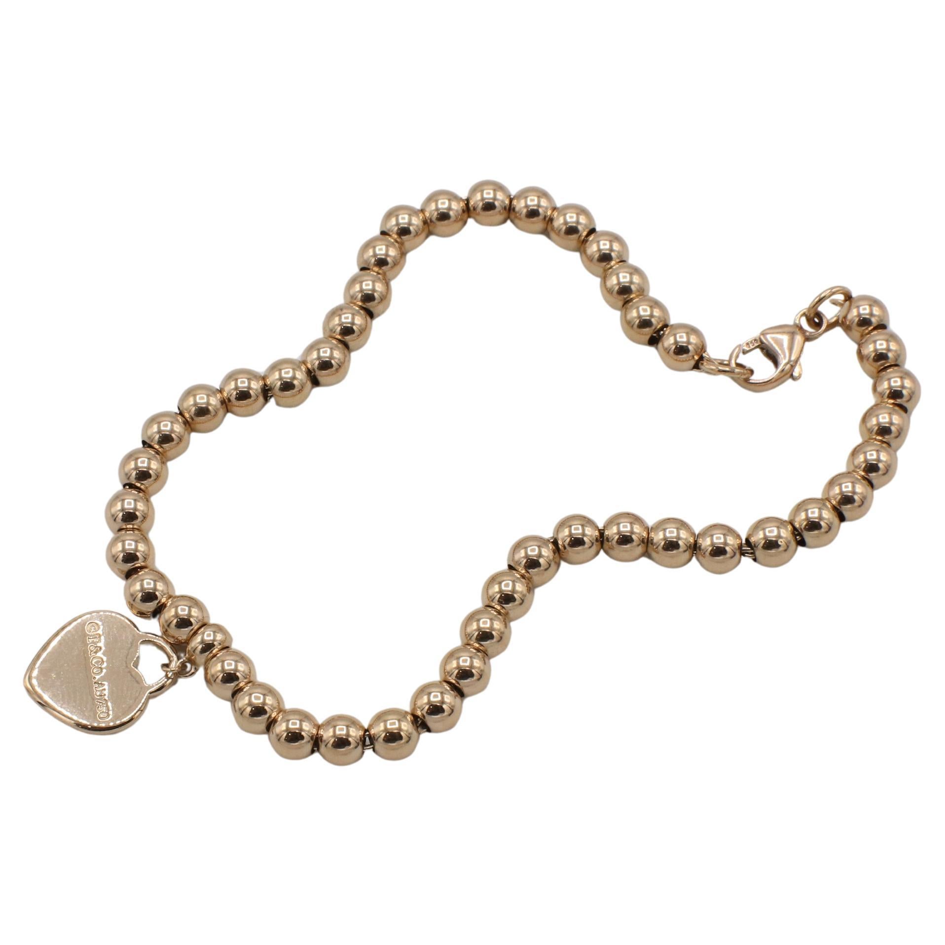 Tiffany & Co. 18 Karat Rose Gold Return To Tiffany Heart Charm Bead Bracelet 
Metal: 18k rose gold
Weight: 8.06 grams
Retail: $2,775
Beads: 4mm
Length: 7 inches
SKU KRD I-15426
