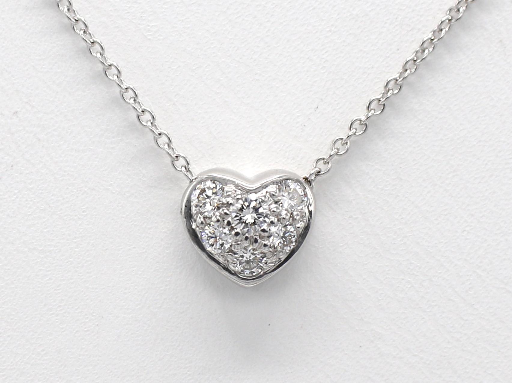 Tiffany & Co. 18 Karat White Gold .20 Carat Natural Diamond Heart Pendant Necklace 
Metal: 18 Karat White Gold
Weight: 2.55 grams
Diamonds: Approx. .20 CTW G VS round natural diamonds
Length: 15 Inches
Heart: 7.3 x 8mm
