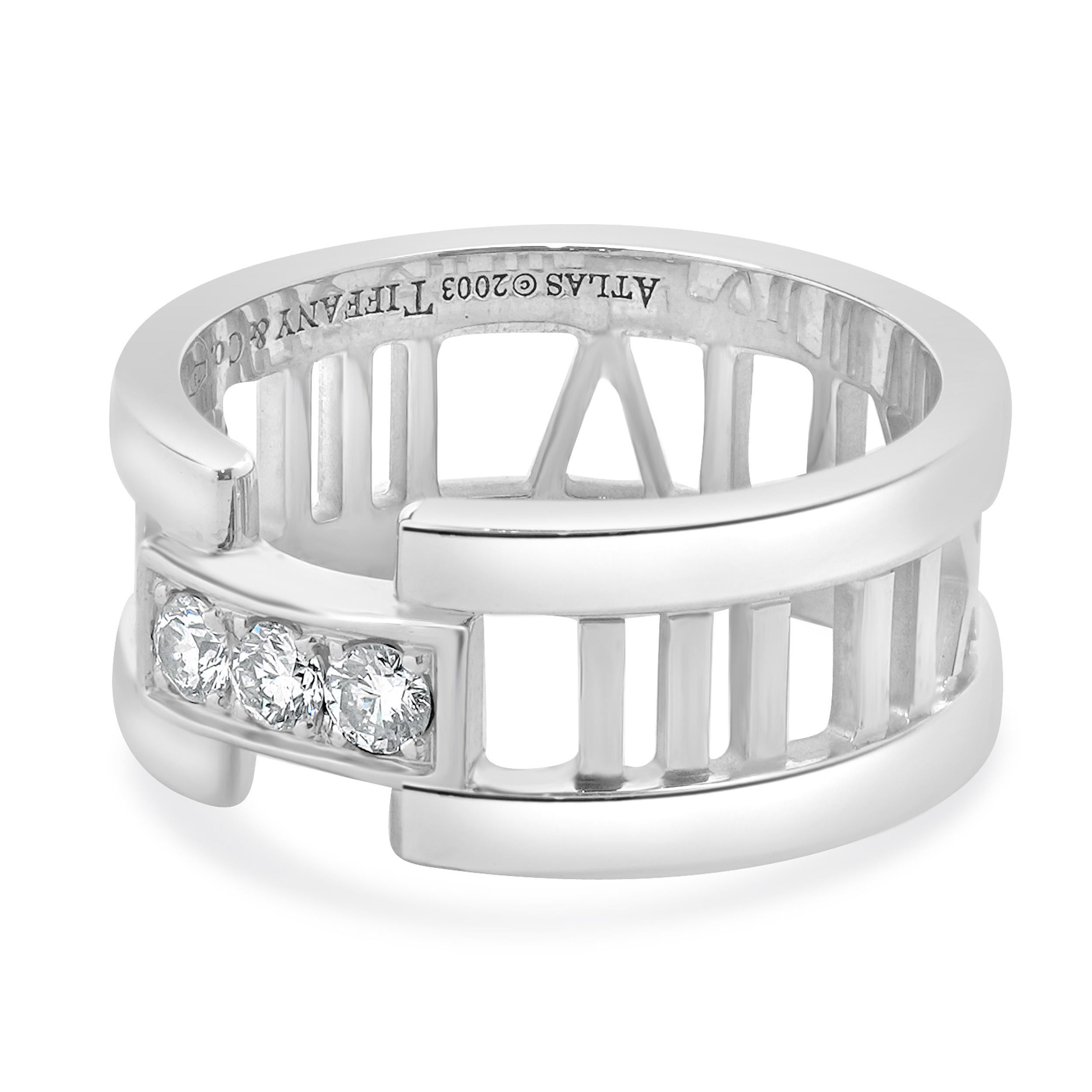 Designer: Tiffany & Co. 
Material: 18K white gold
Diamond: 3 round brilliant cut = 0.15cttw
Color: H
Clarity: SI1
Dimensions: band top measures 8.5mm wide
Size: 6.5
Weight: 7.52 grams

646-994