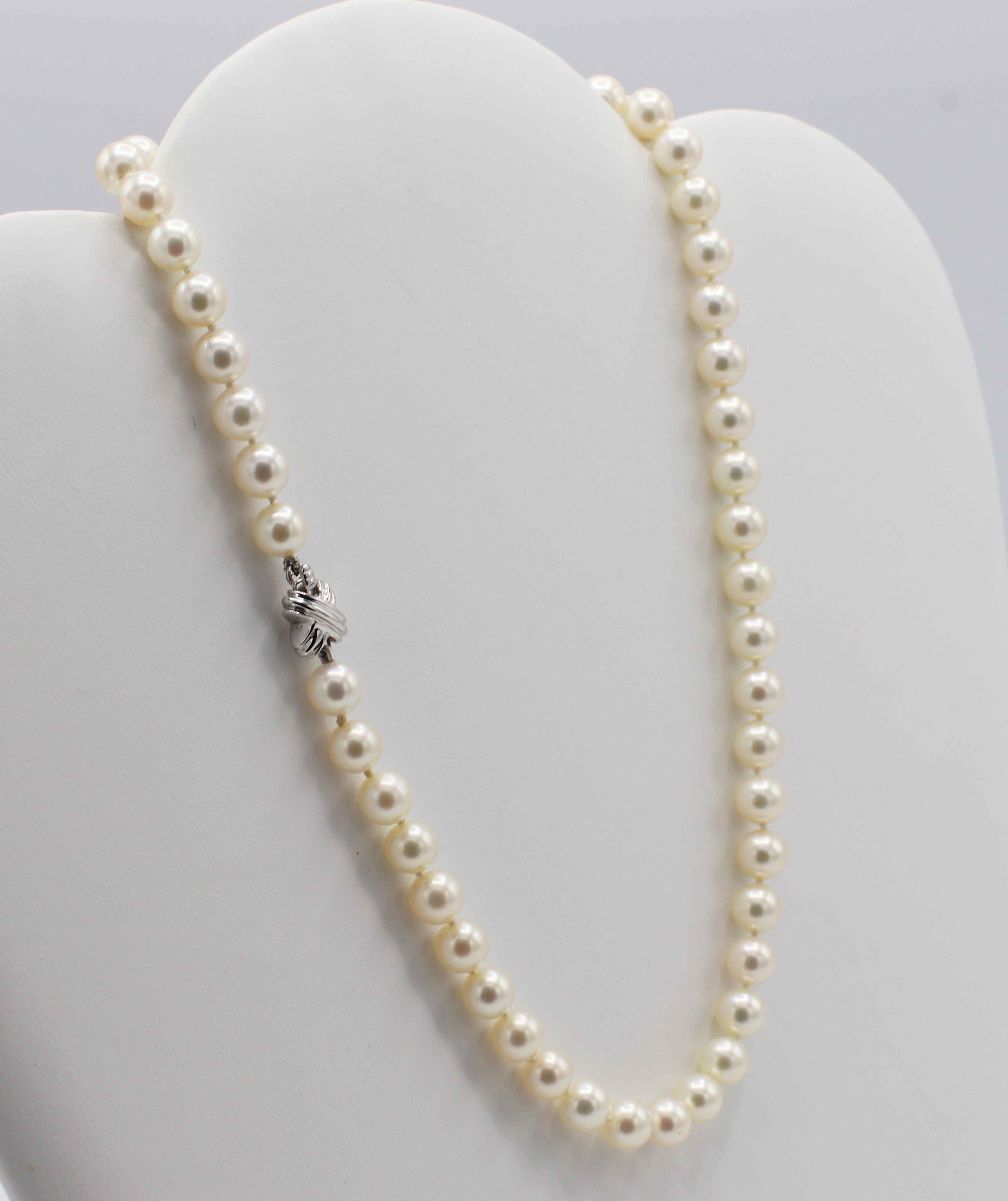 Tiffany & Co. 18 Karat White Gold Akoya Cultured Pearl 7mm Signature X Necklace 
Metal: 18k white gold clasp 
Weight: 30.5 grams
Length: 16 inches 
Pearls: Akoya cultured 7mm pearls
