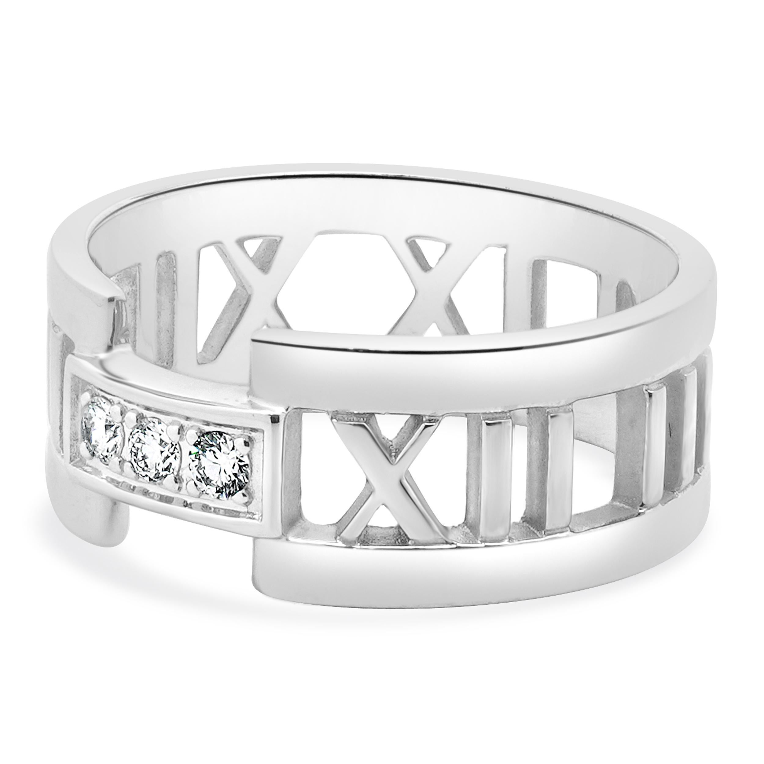 Designer: Tiffany & Co. 
Material: 18K white gold
Diamond: 3 round brilliant cut = 0.10cttw
Color: F
Clarity: VS1-2
Dimensions: ring top measures 8.5mm
Weight: 7.31 grams

646-979