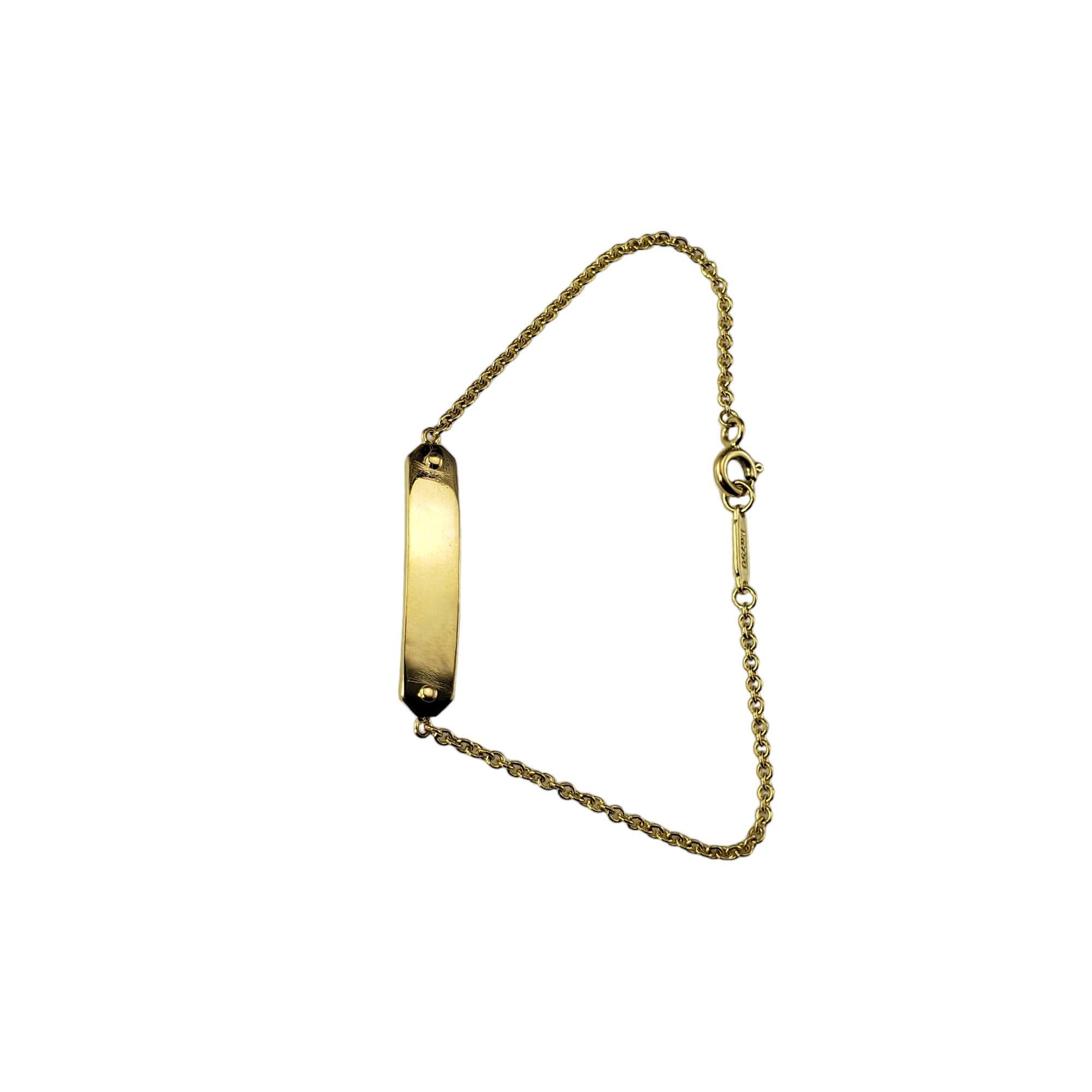 Tiffany & Co. 18K Yellow Gold Child ID Bracelet-

This lovely ID bracelet by Tiffany & Co. is crafted in classic 18K yellow gold.

 Width: 5 mm.

Size:  Fits up to 6 inch wrist

Weight: 2.3 dwt./ 3.6 gr.

Hallmark:  AU 750  TIFFANY & CO.

Very good