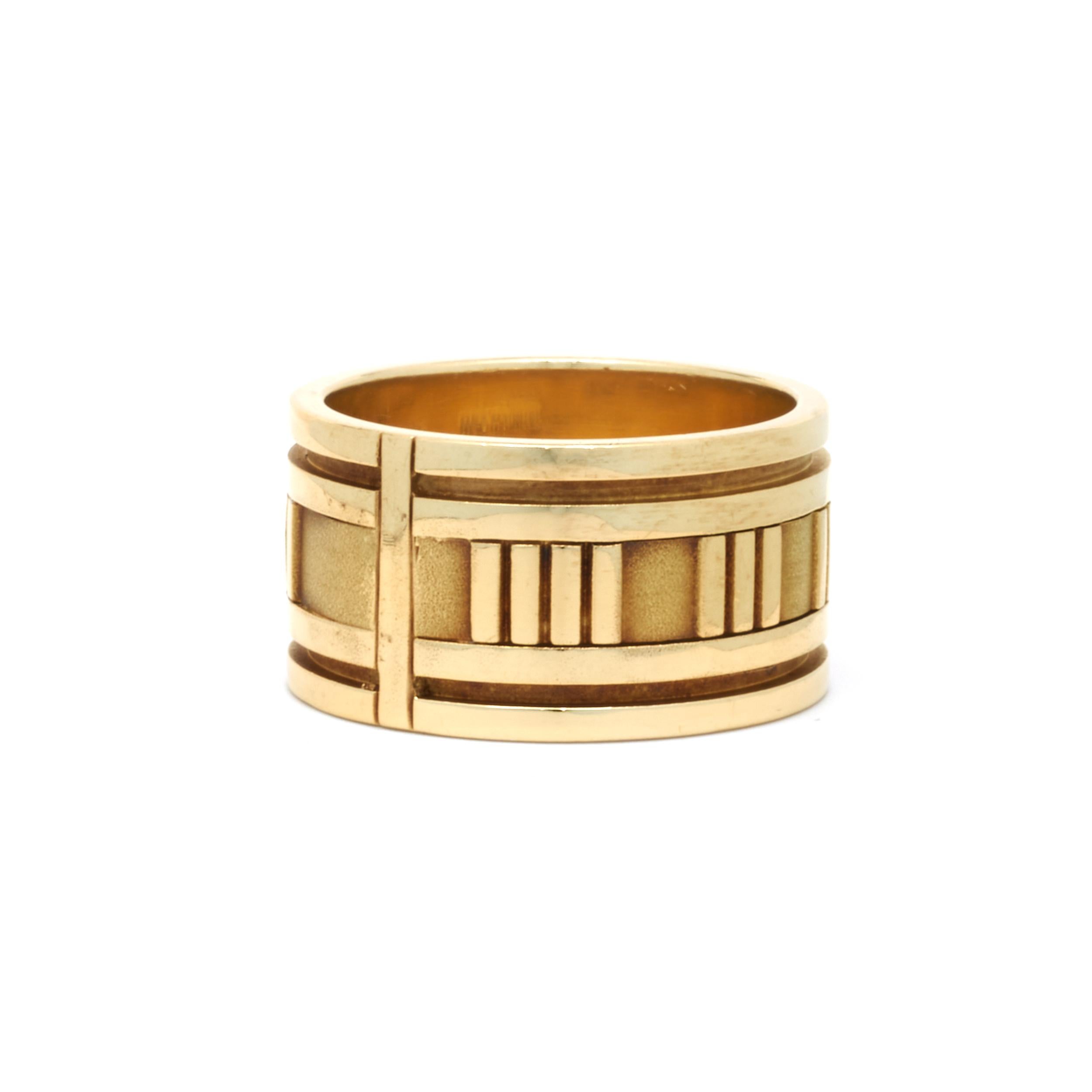Designer: Tiffany & Co. 
Material: 18K yellow gold
Dimensions: band measures 12mm
Size 9
Weight: 16.36 grams
