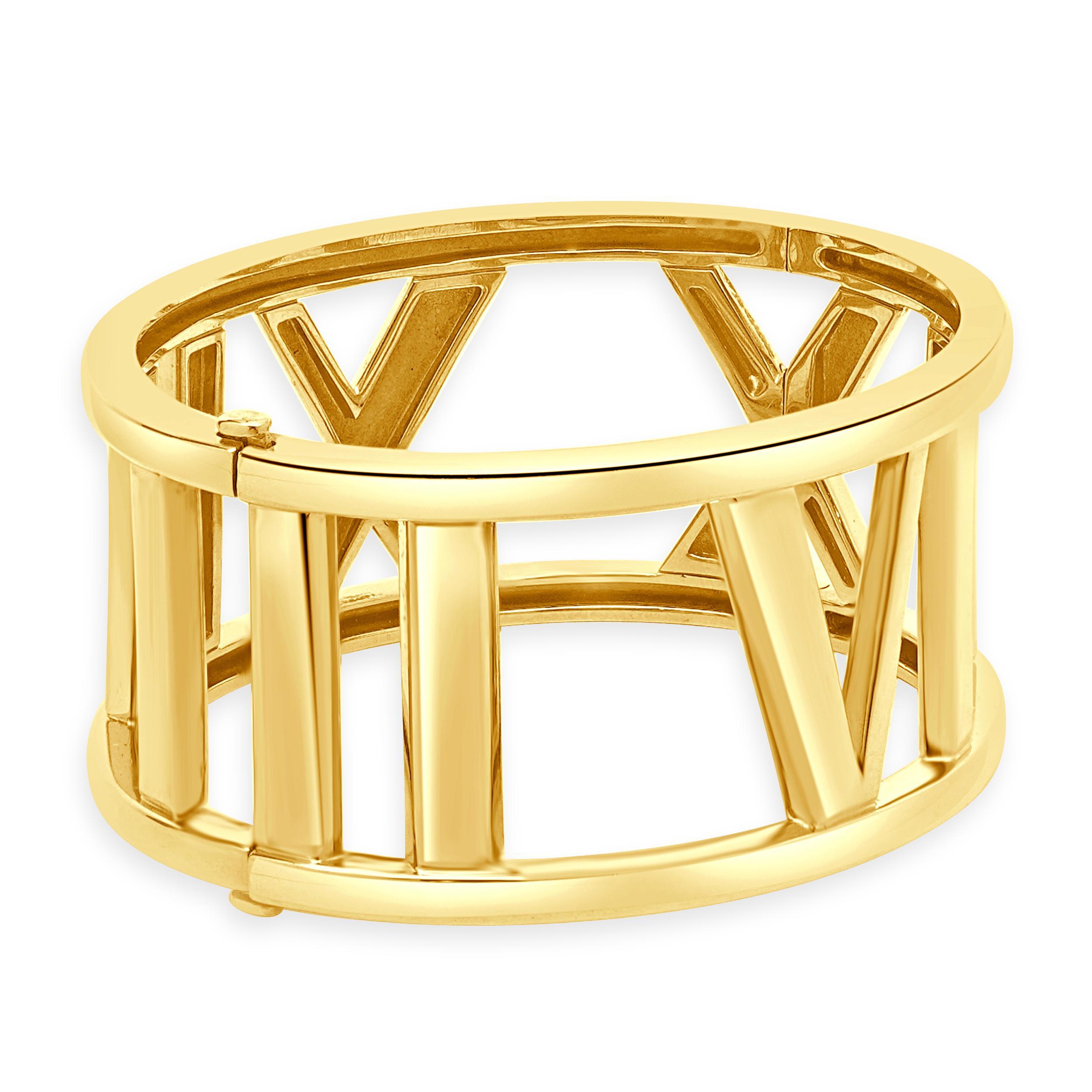 Designer: Tiffany & Co. 
Material: 18K yellow gold
Dimensions: bracelet top measures 29mm wide, fits up to a 6.25-inch wrist
Weight: 79.60 grams