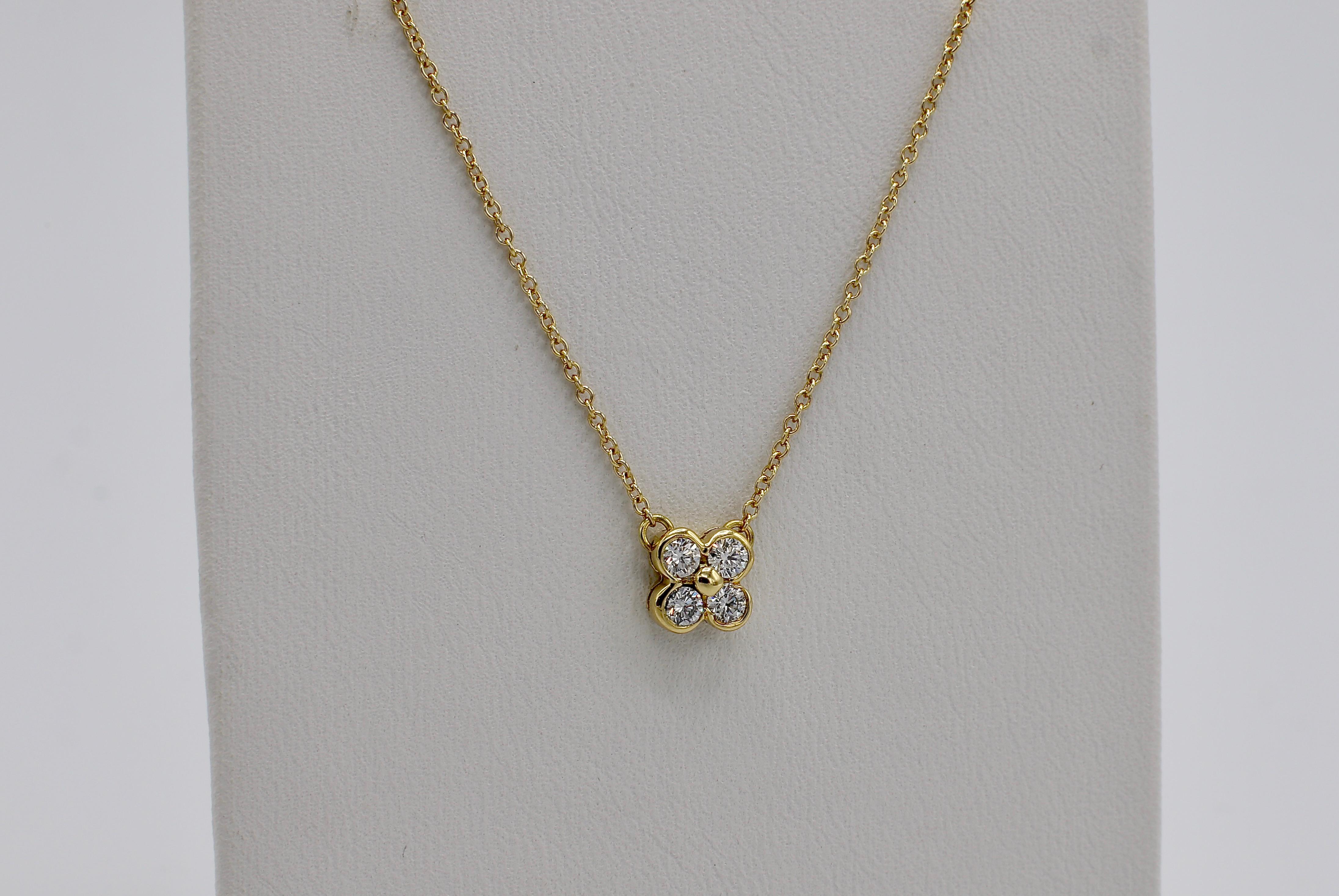 Tiffany & Co. 18 Karat Yellow Gold .21 Carat Diamond Bezel Set Cluster Pendant Necklace 16 inch chain 
Metal: 18k yellow gold
Weight: 2.17 grams
Diamonds: .21 CTW F-G VS
Pendant diameter: 6.2MM
Chain length: 16 inches

