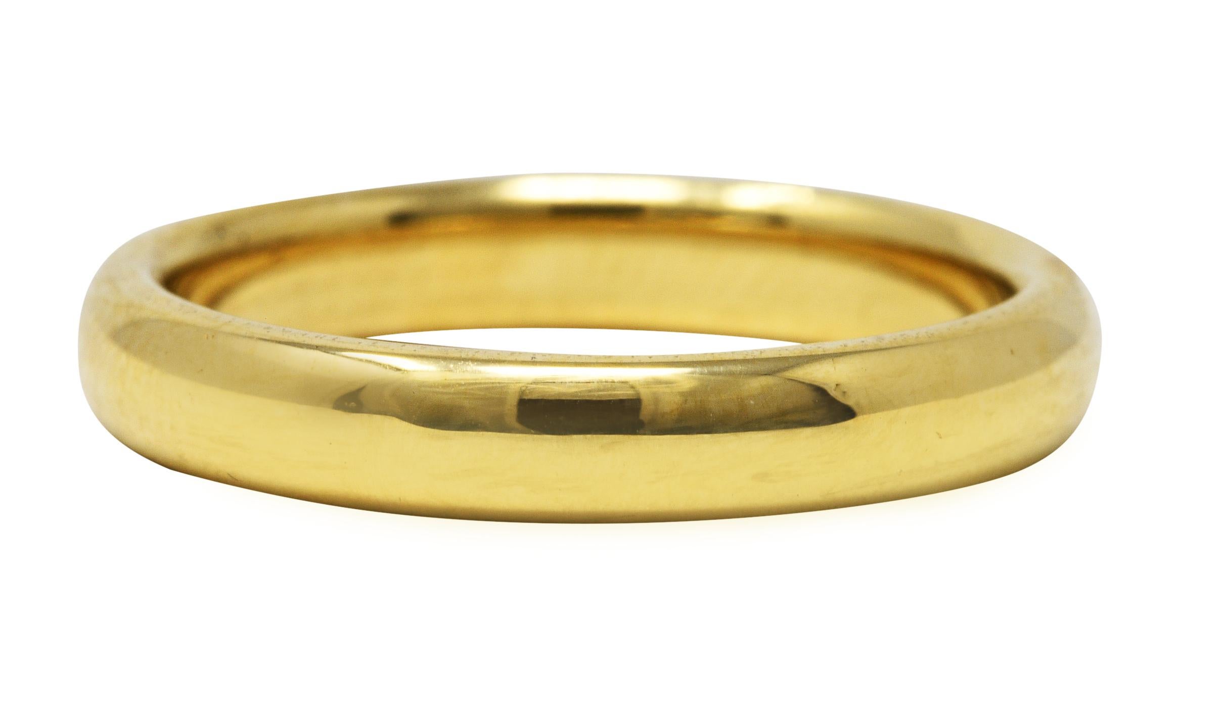 Wide band ring is designed with a rounded curvature

With a brightly polished finish

Stamped 750 for 18 karat gold 

Fully signed Tiffany & Co.

Ring Size: 9 3/4 & sizable

Measures North to South 4.0 mm and sits 2.0 mm high

Total weight: 7.9