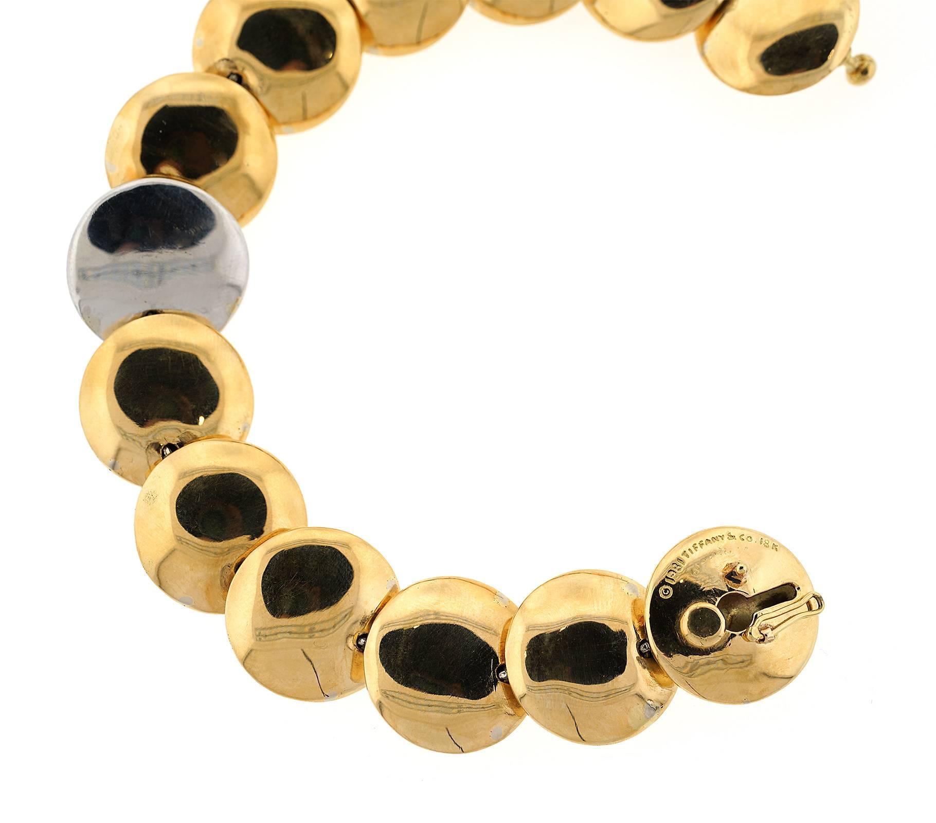 The bracelet is 18mm wide, 7.5 inches in length, made of yellow gold and platinum, and weighs 34.6 DWT (approx. 53.81 grams). It also has 39 round G-color, VS-clarity diamonds weighing 0.55 CTTW, and 64 single cut G-color, VS-clarity diamonds