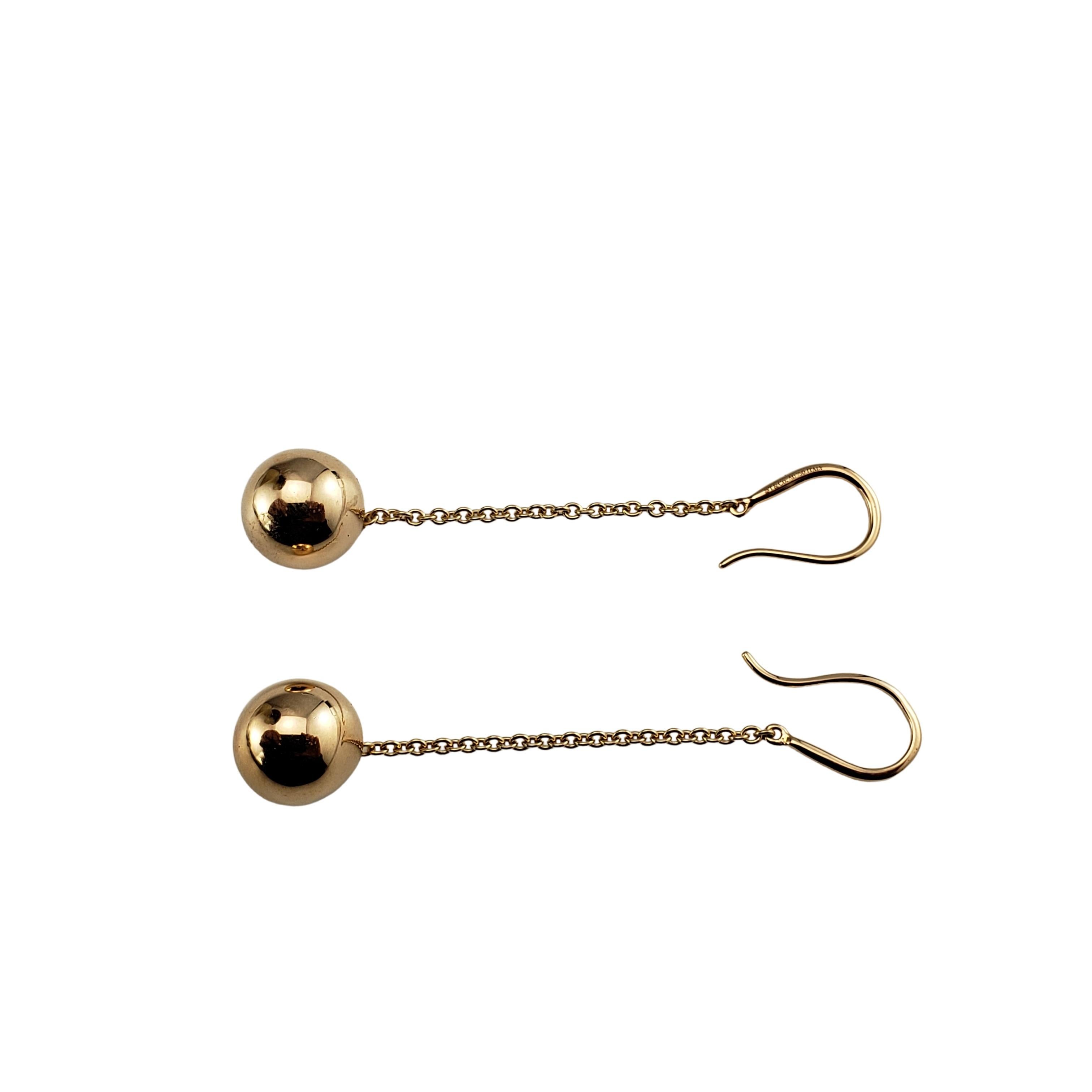 Vintage Tiffany & Co 18 Karat Yellow Gold Ball Hook Drop Earrings-

These timeless 18K yellow gold drop earrings by Tiffany and Co. features a polished gold ball suspended from a delicate hook and chain.

Size:  2 inches (drop)
          10 mm