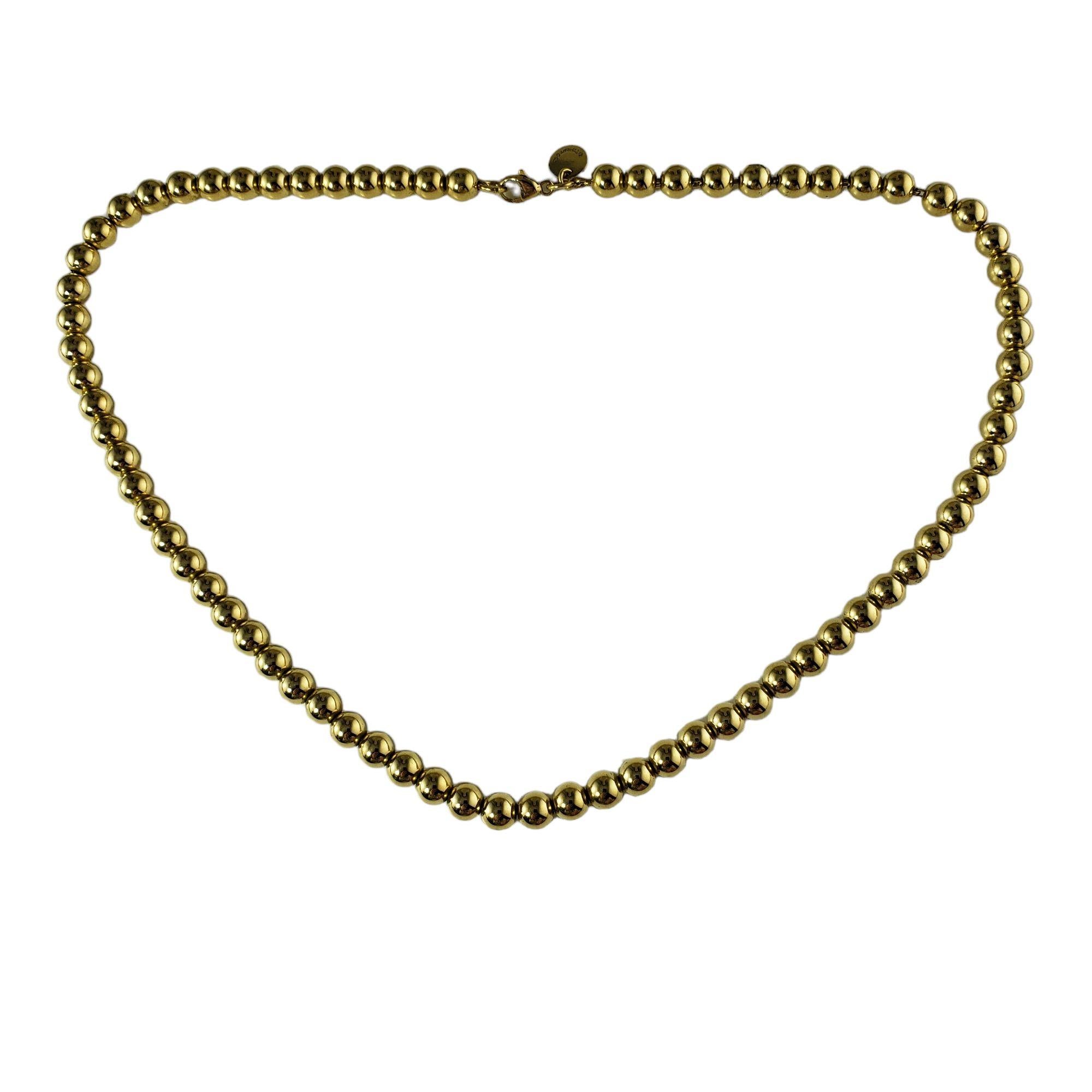 Tiffany & Co. 18 Karat Yellow Gold Bead Necklace-

This elegant bead necklace by Tiffany & Co. is crafted in beautifully detailed 18K yellow gold.  Width:  5 mm.

Size:  16 inches 
        
Weight:   22.1 gr./   14.2 dwt.

Hallmark:  TIFFANY & CO.  