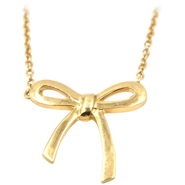 Tiffany and Co. 18 Karat Yellow Gold Bow Pendant Necklace at 1stDibs