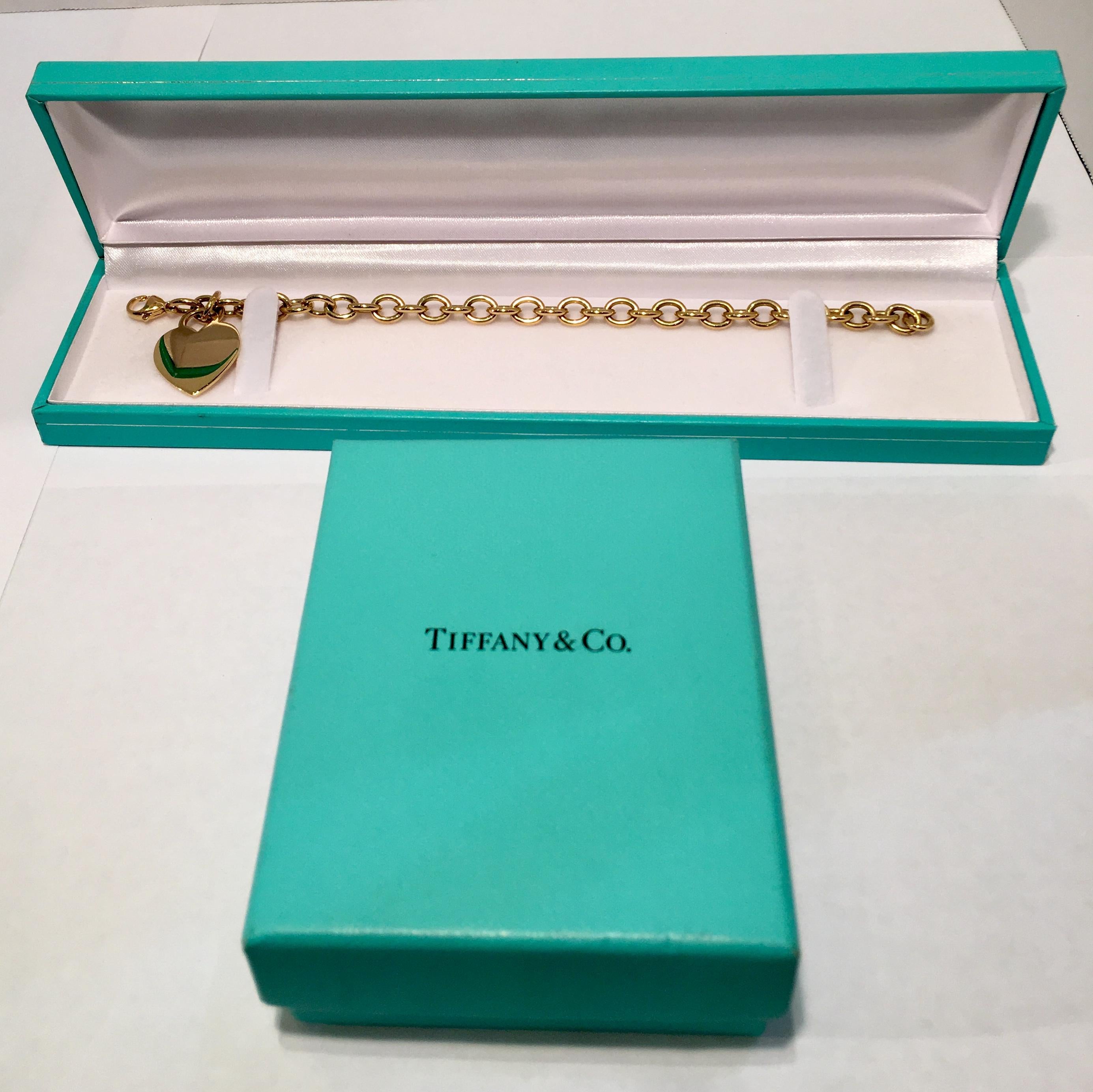 Tiffany & Co. Heart Tag 18 Karat Yellow Gold Charm Bracelet In Excellent Condition In Tustin, CA