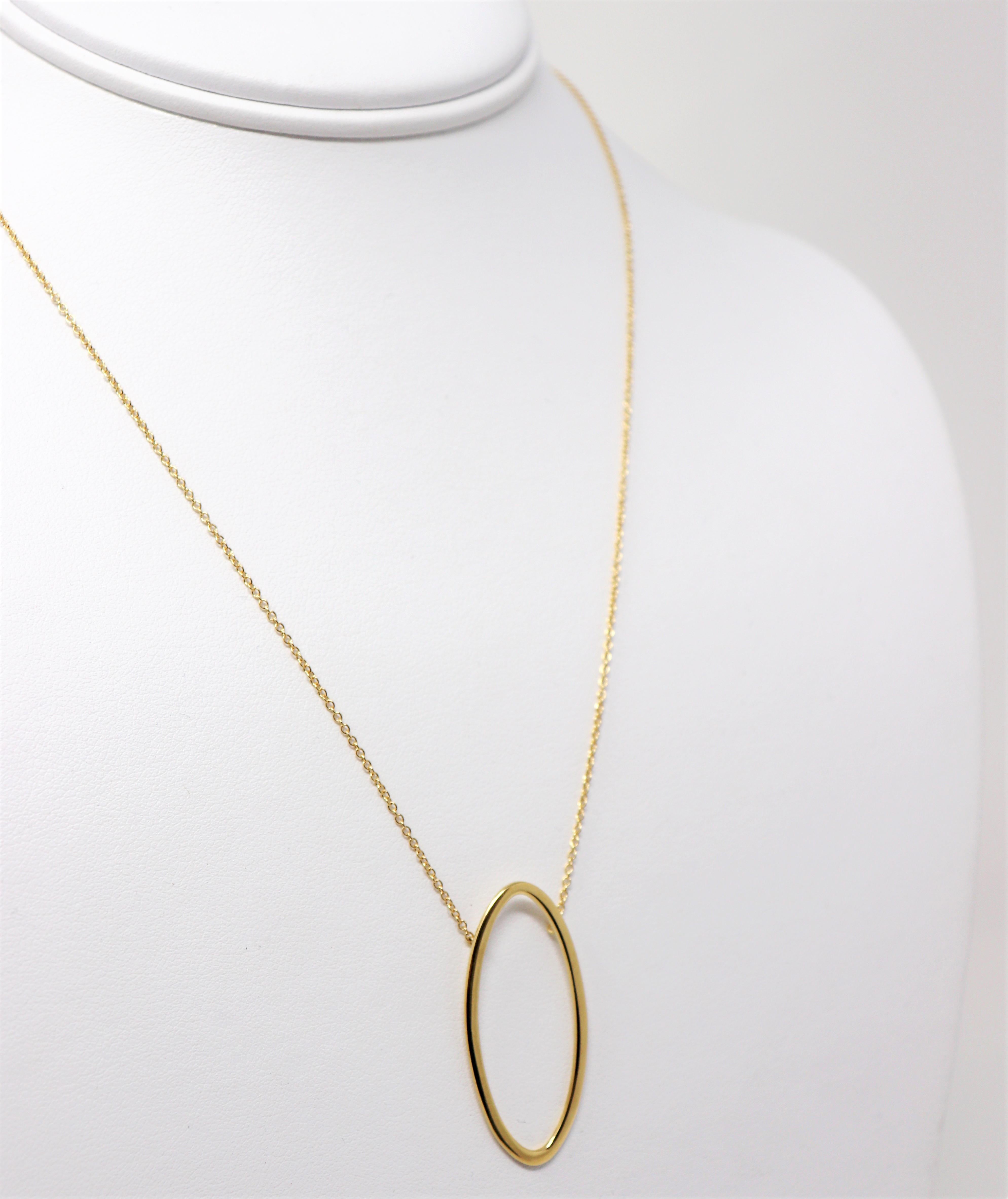 Lovely golden pendant necklace by Tiffany & Co. is the epitome of modern elegance. The timeless design combined with the warm yellow gold setting makes for a piece that you will wear time and time again.  

This beautiful designer necklace features