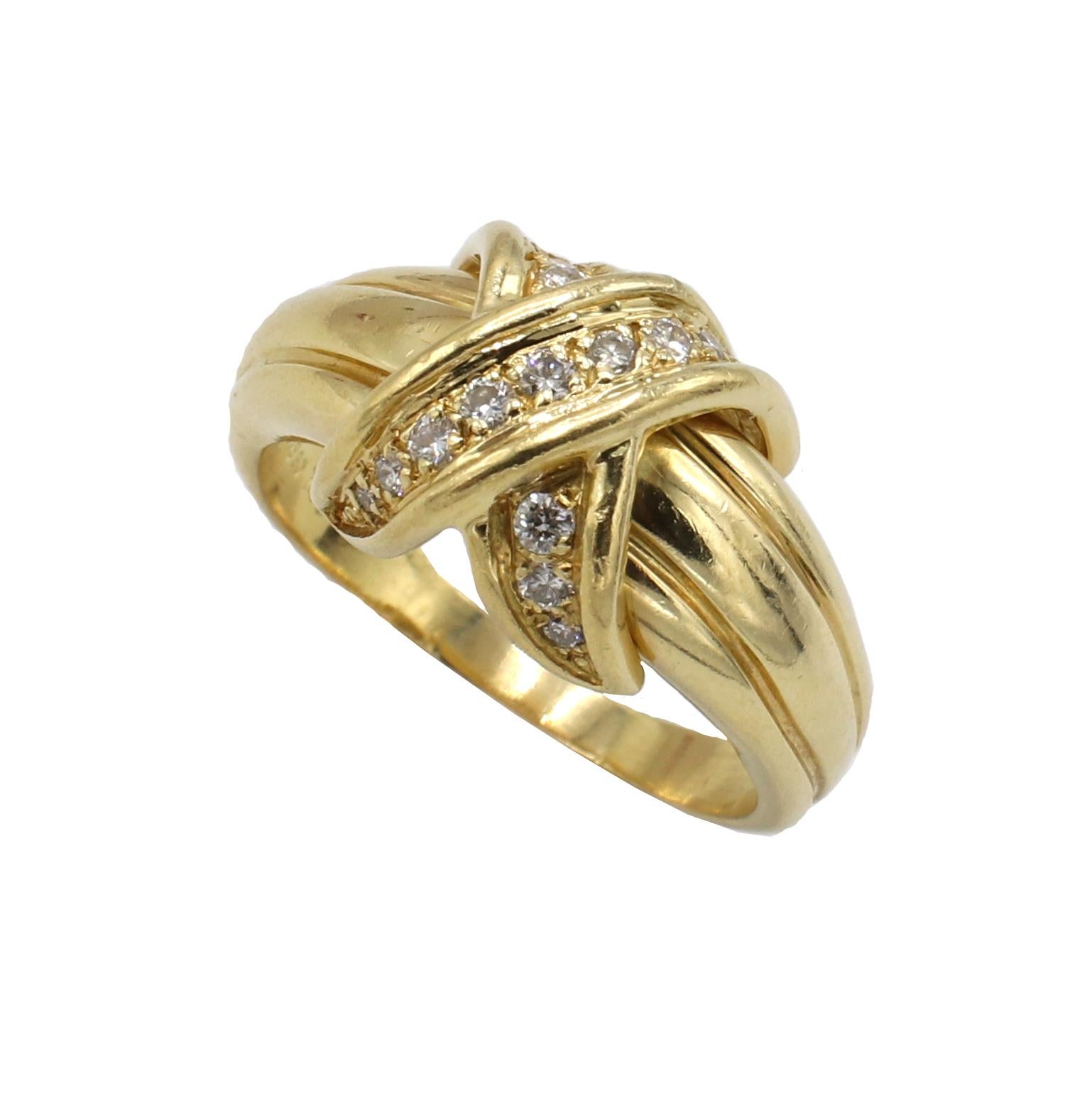 Tiffany & Co. 18 Karat Yellow Gold Diamond Signature X  Ring 
Metal: 18k yellow gold
Weight: 6.37 grams
Diamonds: Approx. .15 CTW G-H VS round diamonds
Size: 5.75 (US)
Height: 6mm
Signed: Tiffany & Co. 1990 750
