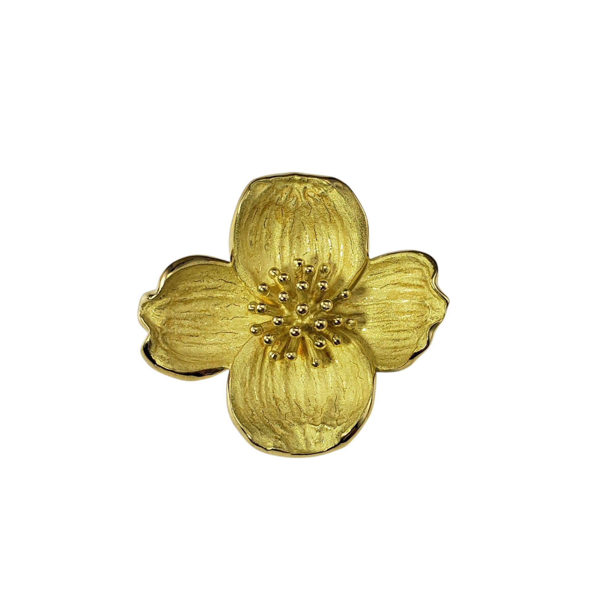 Tiffany & Co. 18 Karat Yellow Gold Dogwood Flower Brooch-

This elegant piece by Tiffany & Co. is inspired by the delicate beauty of the dogwood blossom. Made from solid 18K yellow gold, the brooch showcase a realistic, sculpted dogwood flower with