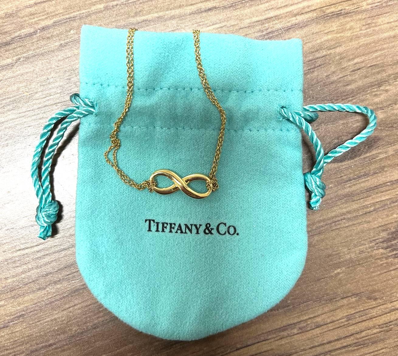 Tiffany & Co. 18 Karat Yellow Gold Double Chain Infinity Pendant Necklace In Excellent Condition In  Baltimore, MD