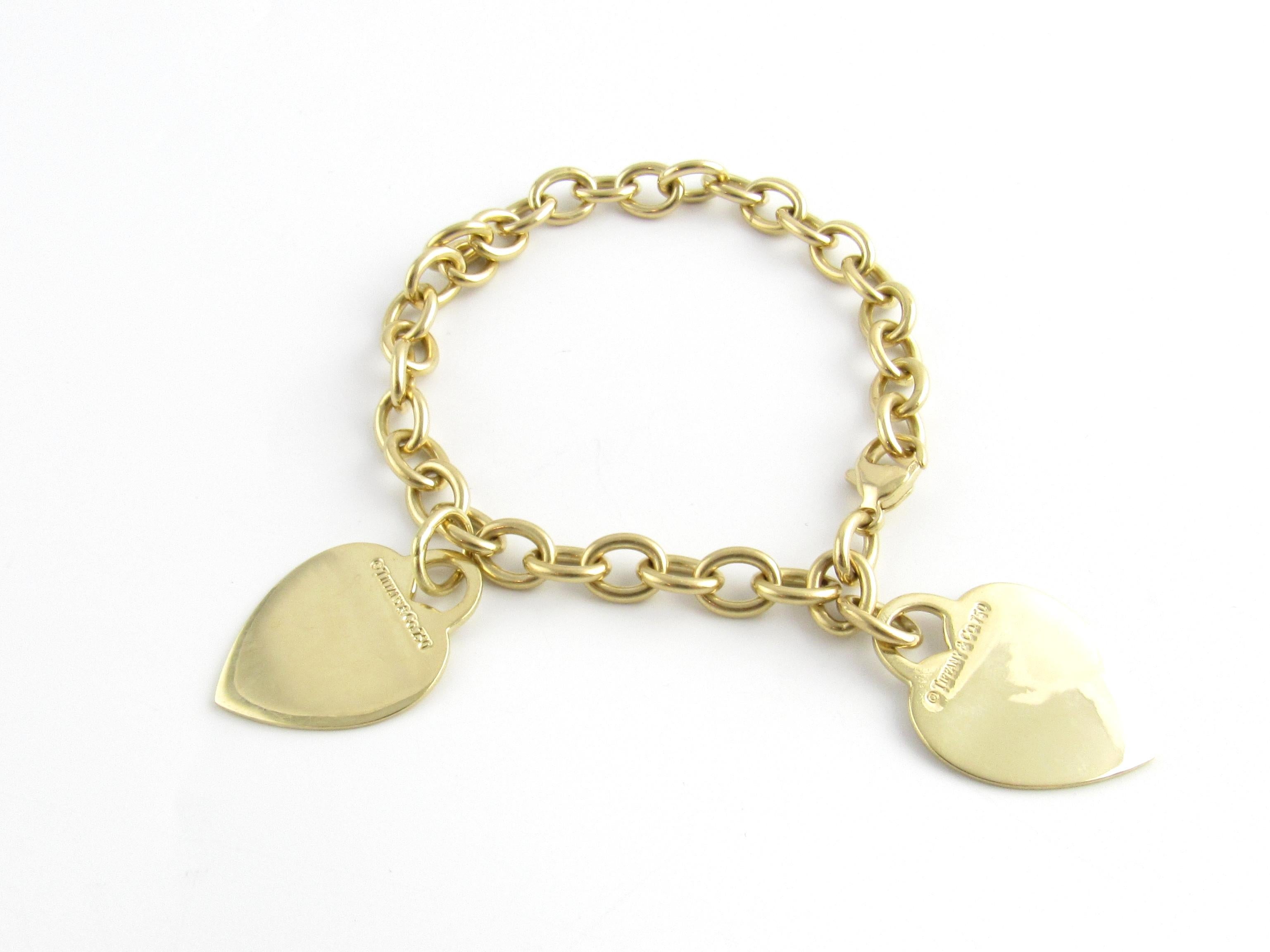 Tiffany & Co. 18K Yellow Gold Double Heart Tag Charm Bracelet

This authentic Tiffany & Co. 18K Yellow Gold Charm Bracelet is approx 7.75