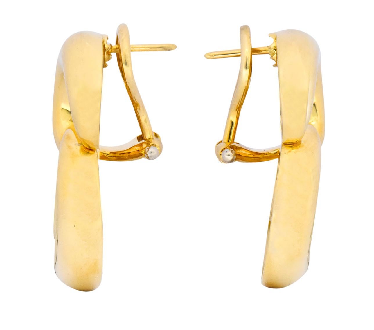 Each earring is designed as an articulated figure eight form

Hollow with a high polished finish

Completed by post and hinged omega back

Fully signed Tiffany & Co. 

Stamped 750 for 18 karat gold

Measures: 1 1/16 x 3/4 inch

Total weight: 19.2