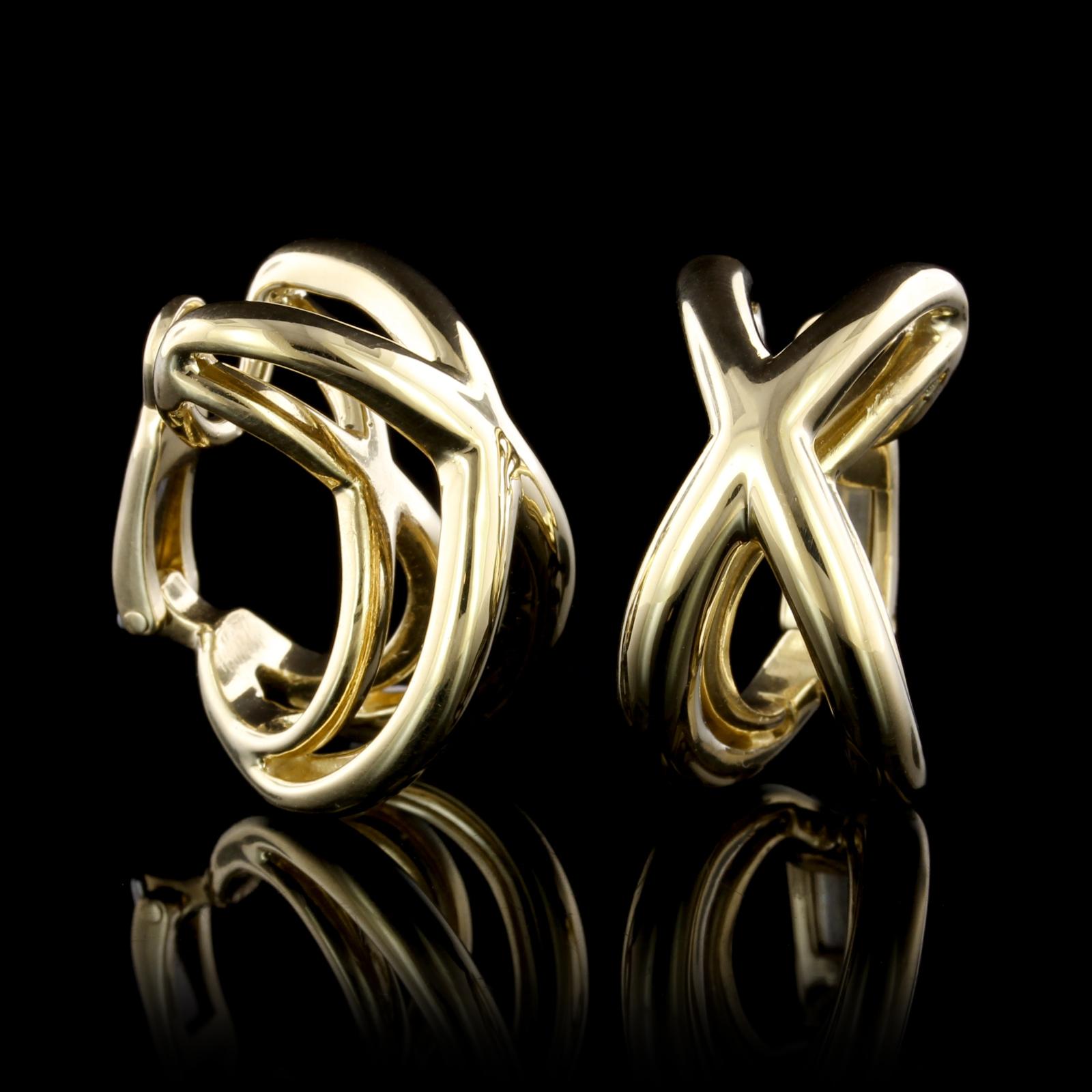 Tiffany & Co. 18K Yellow Gold Earrings. Each earrings is a domed X design, width 1/2