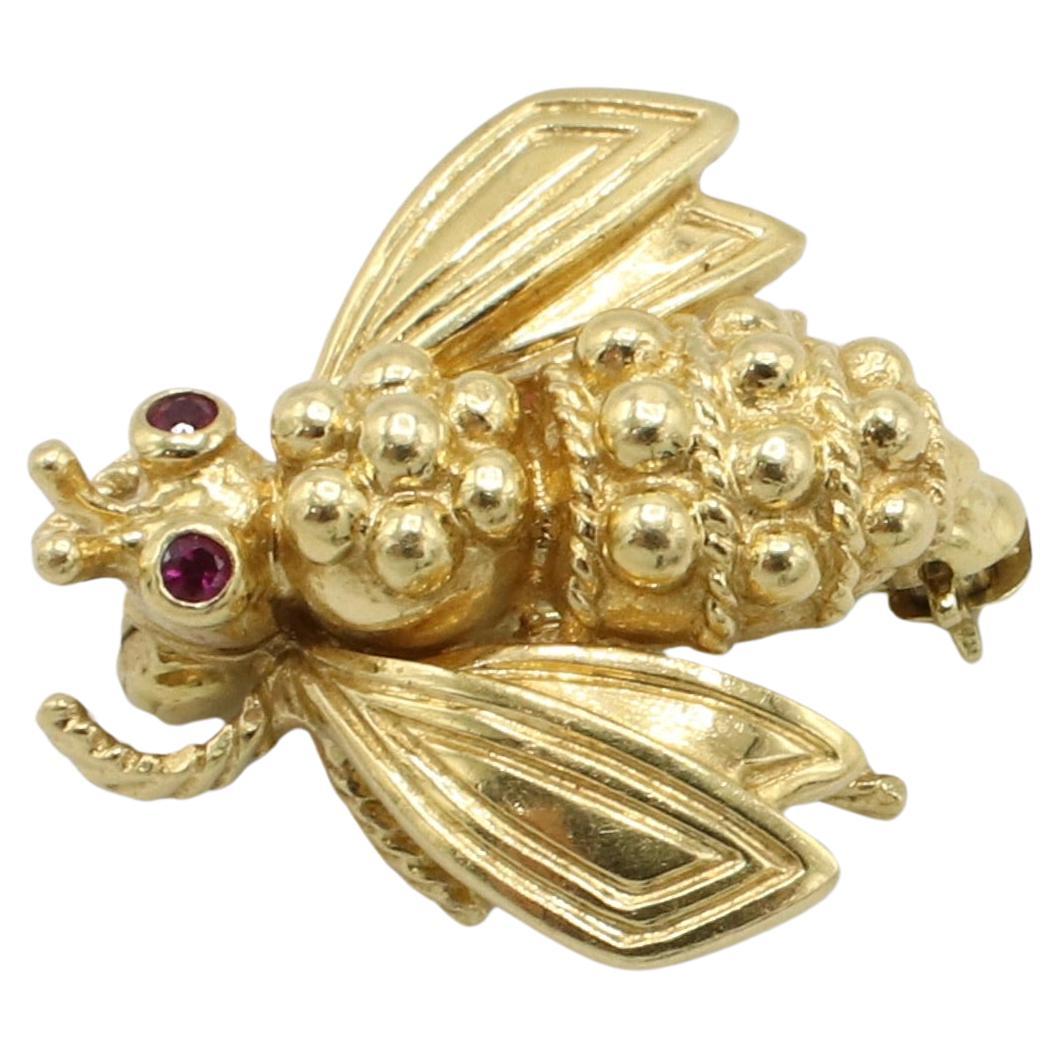 Tiffany & Co. 18 Karat Yellow Gold Fly Pin Brooch With Ruby Eyes 
Metal: 18k yellow gold
Weight: 5.4 grams
Dimensions: 19 x 18.5mm
Signed: ©Tiffany & Co. 750