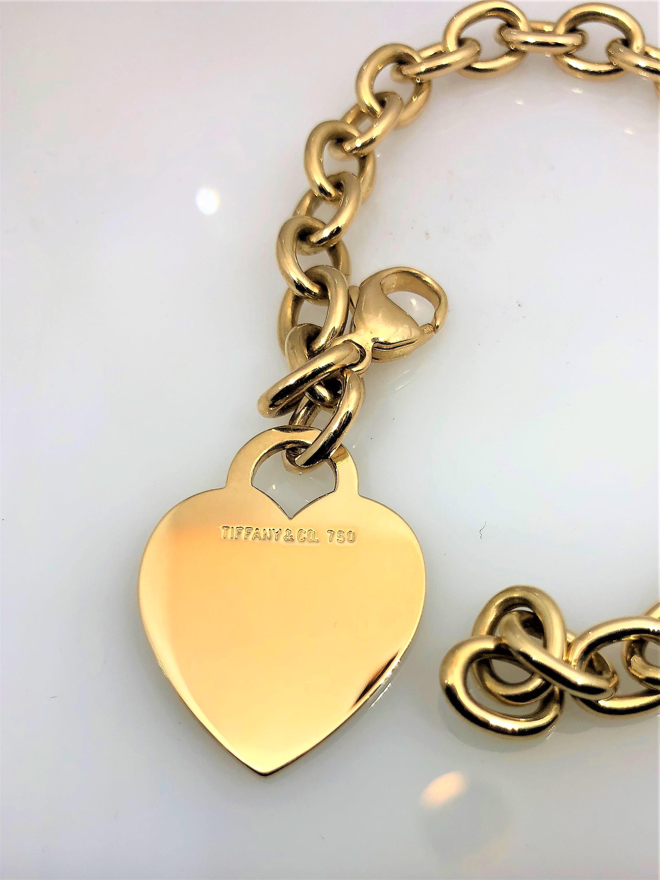 Tiffany & Co. 18 Karat Yellow Gold Heart Tag Charm Bracelet In Excellent Condition In Mansfield, OH