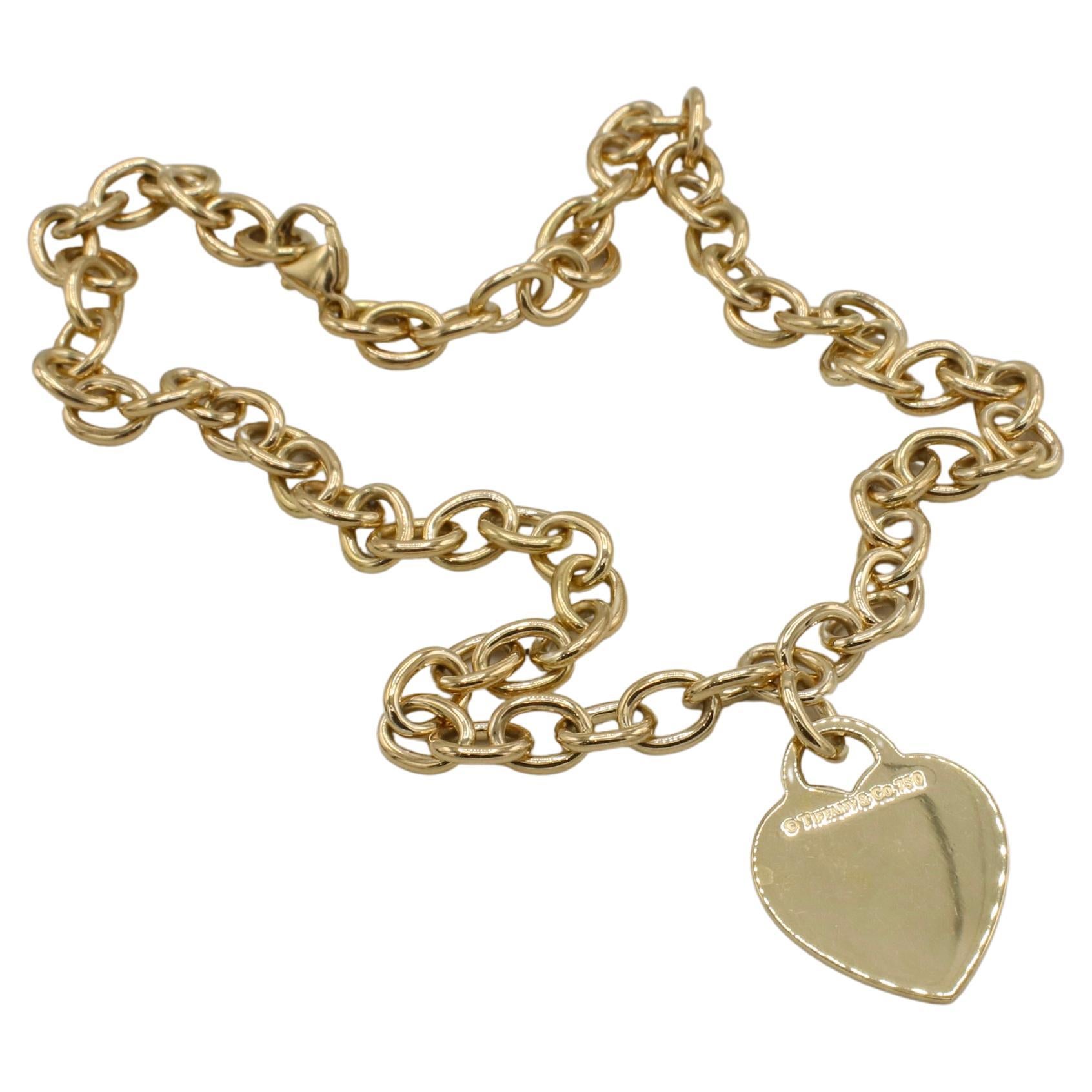 Tiffany & Co. 18 Karat Yellow Gold Heart Tag Charm Chain Link Necklace
Metal: 18k yellow gold
Weight: 48 grams
Length: 16 inches
Heart: 20 x 27mm
Signed:  ©Tiffany & Co. 750
Links: 6.5 x 8.5mm
Note: Box has slight damage
LTDD 111064-1
