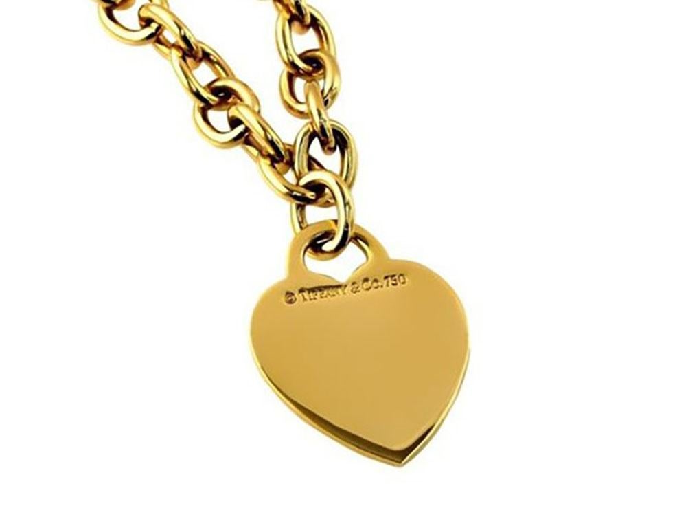 Lovely 18k yellow gold estate Tiffany & Co. heart tag necklace. Stamped Tiffany & Co. This necklace measures 16