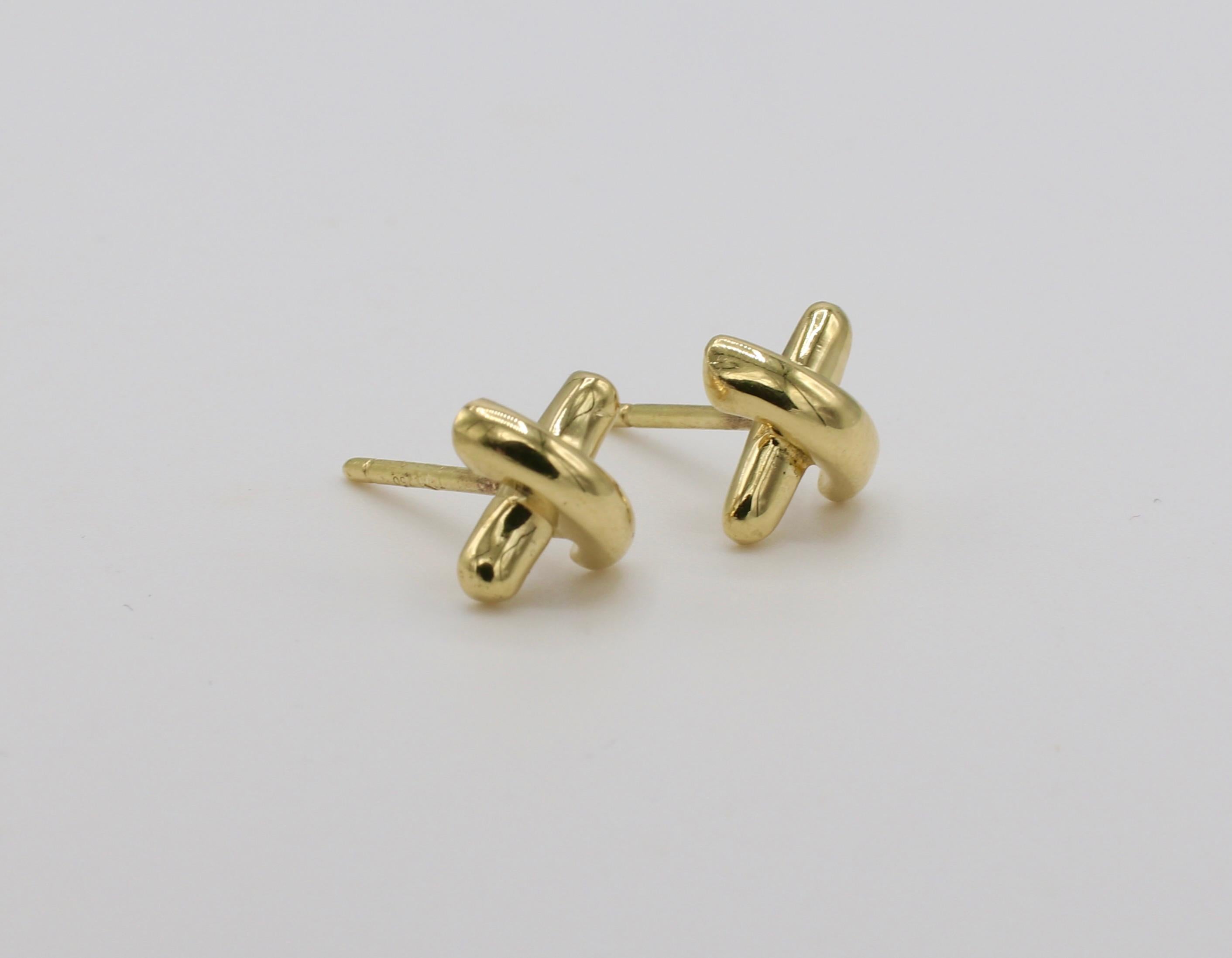 Tiffany & Co. 18 Karat Yellow Gold Kisses X Motif Stud Earrings 
Metal: 18k yellow gold
Weight: 2.17 grams 
Diameter: 7MM
Signed T&Co 750 on back and posts 


