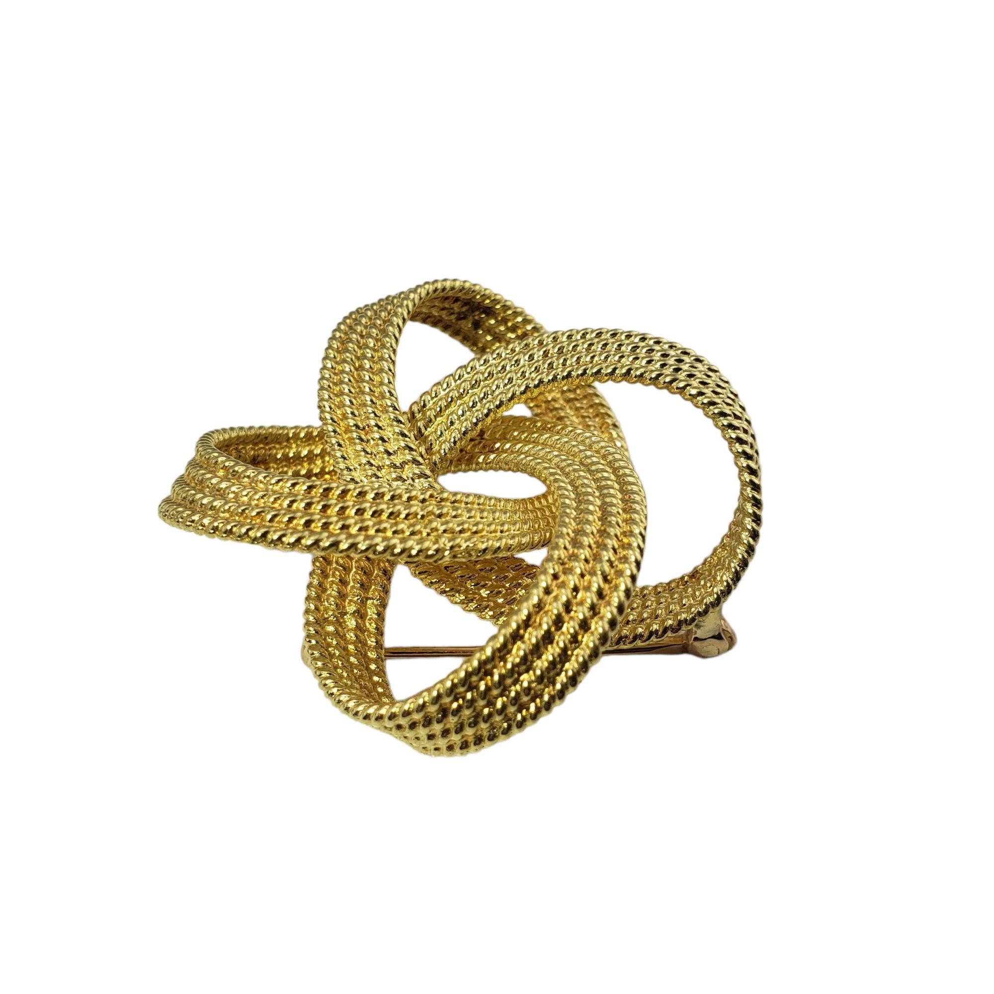 Vintage Tiffany & Co. 18 Karat Yellow Gold Knot Brooch/Pin-

This stunning brooch by Tiffany & Co. is meticulously crafted in beautifully detailed 18K yellow gold.

Size: 40 mm

Weight: 13.9 dwt. / 21.67 gr.

Hallmark: 18K Tiffany & Co

Very good
