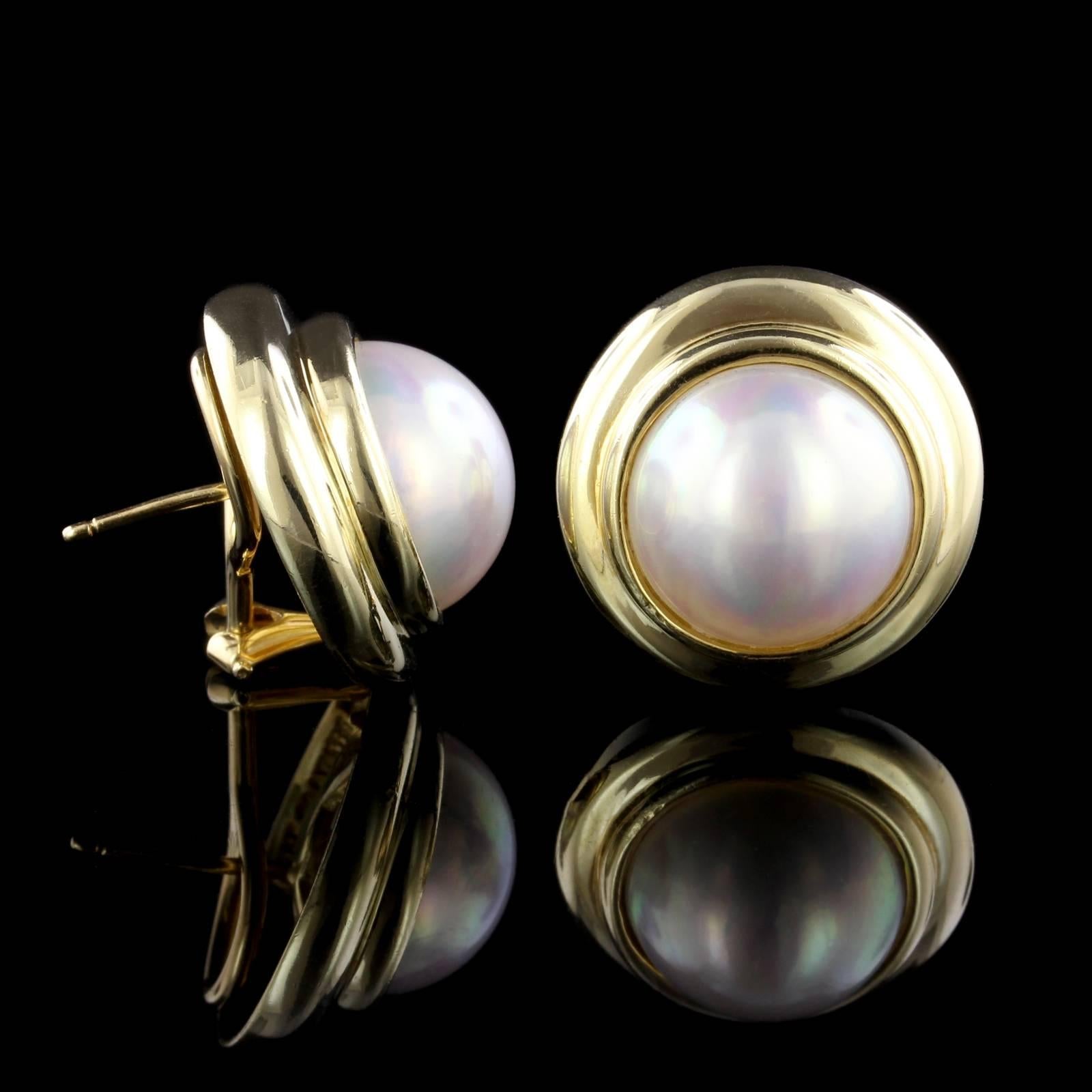 Tiffany & Co. 18K Yellow Gold Mabe Pearl Earrings. The earrings are bezel set with two mabe pearls each measuring 13.50mm., diameter 3/4