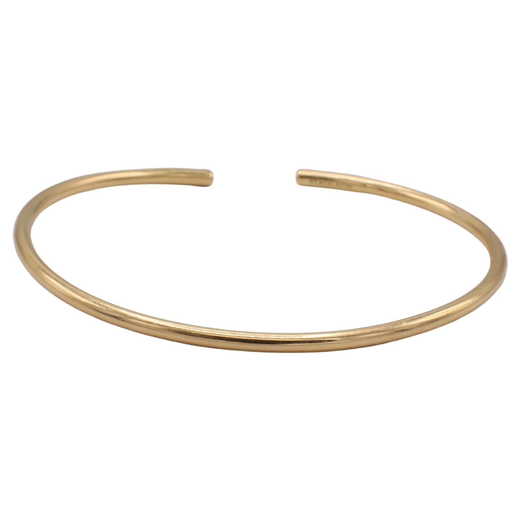 Tiffany & Co. 18 Karat Yellow Gold Metro Wire Pink Tourmaline Bangle Bracelet
Metal: 18k yellow gold
Weight: 5.4 grams
Size: Fits up to a 7 inch wrist
Width: 2.5mm
Signed: ©T&Co. Au750
ATD 111020-11