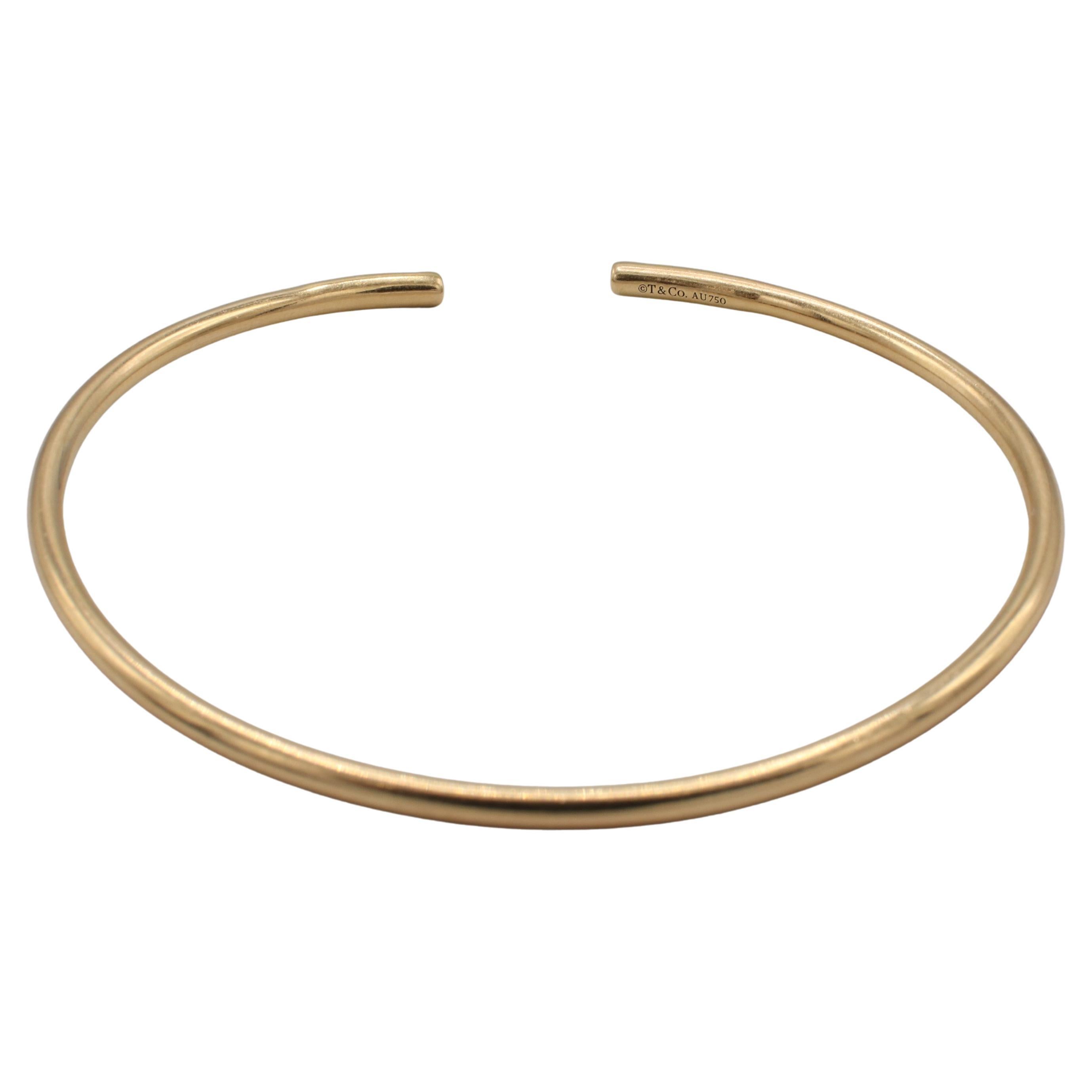 Modern Tiffany & Co. 18 Karat Yellow Gold Metro Wire Pink Tourmaline Bangle Bracelet For Sale