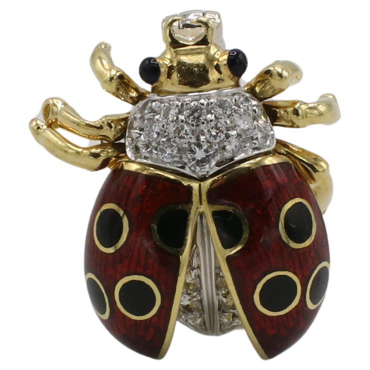 Tiffany & Co. 18 Karat Yellow Gold Natural Diamond Enamel Lady Bug Brooch Pin Clip

Metal: 18k yellow gold
Weight: 7.51 grams
Dimensions: 21 x 18.5mm
Diamonds: 24 round natural diamonds approx. 0.25 CTW F-G VVS
Signed: Tiffany & Co. 750
ODD F35000793