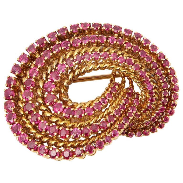 Tiffany & Co. 18-karat yellow gold and round-cut ruby brooch, 1940s 