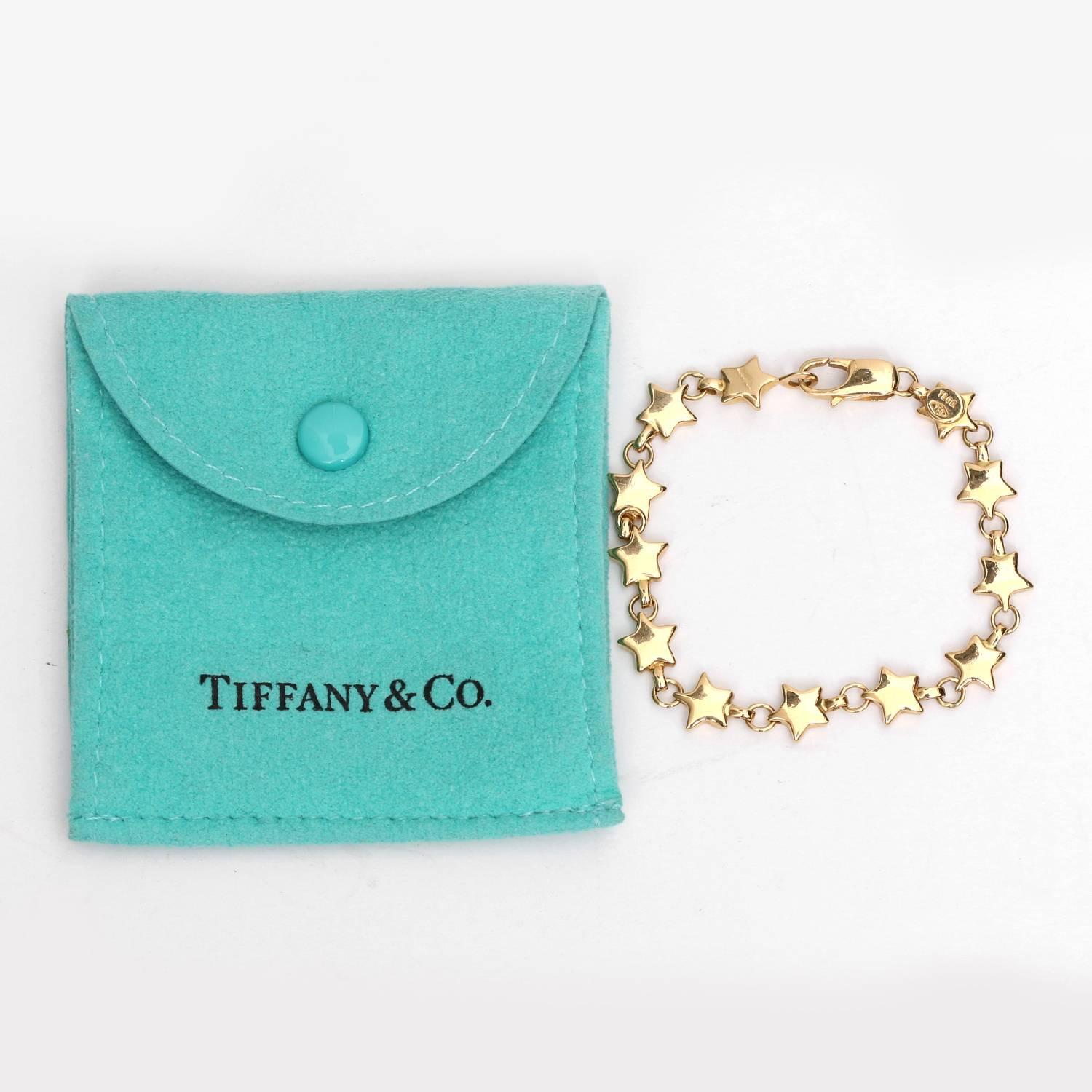 Tiffany & co. 18K Yellow Gold Star Link Bracelet  - 18K Yellow gold link bracelet. Hallmark, 750 & T&CO. Lobster clasp closure. Approximately 6 inches long. Total weight 13.8 grams. Pre-owned with Tiffany & Co. pouch.