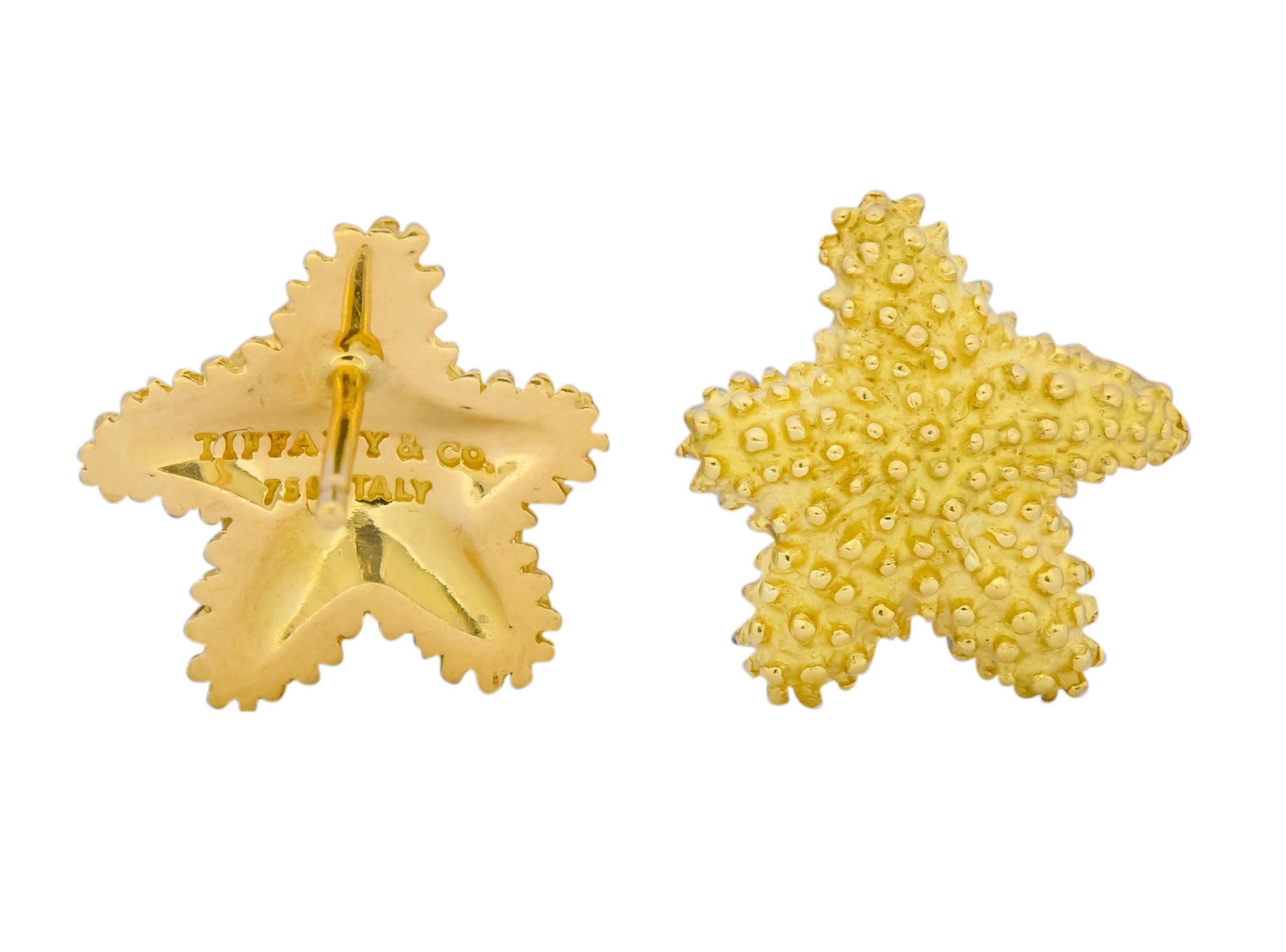 Yellow gold earrings designed as starfish exhibiting a matte gold finish

With polished small gold beading throughout

Completed by post and friction backs

Fully signed Tiffany & Co. Italy

Stamped 750 for 18 karat gold

Measures: 9/16 x 9/16