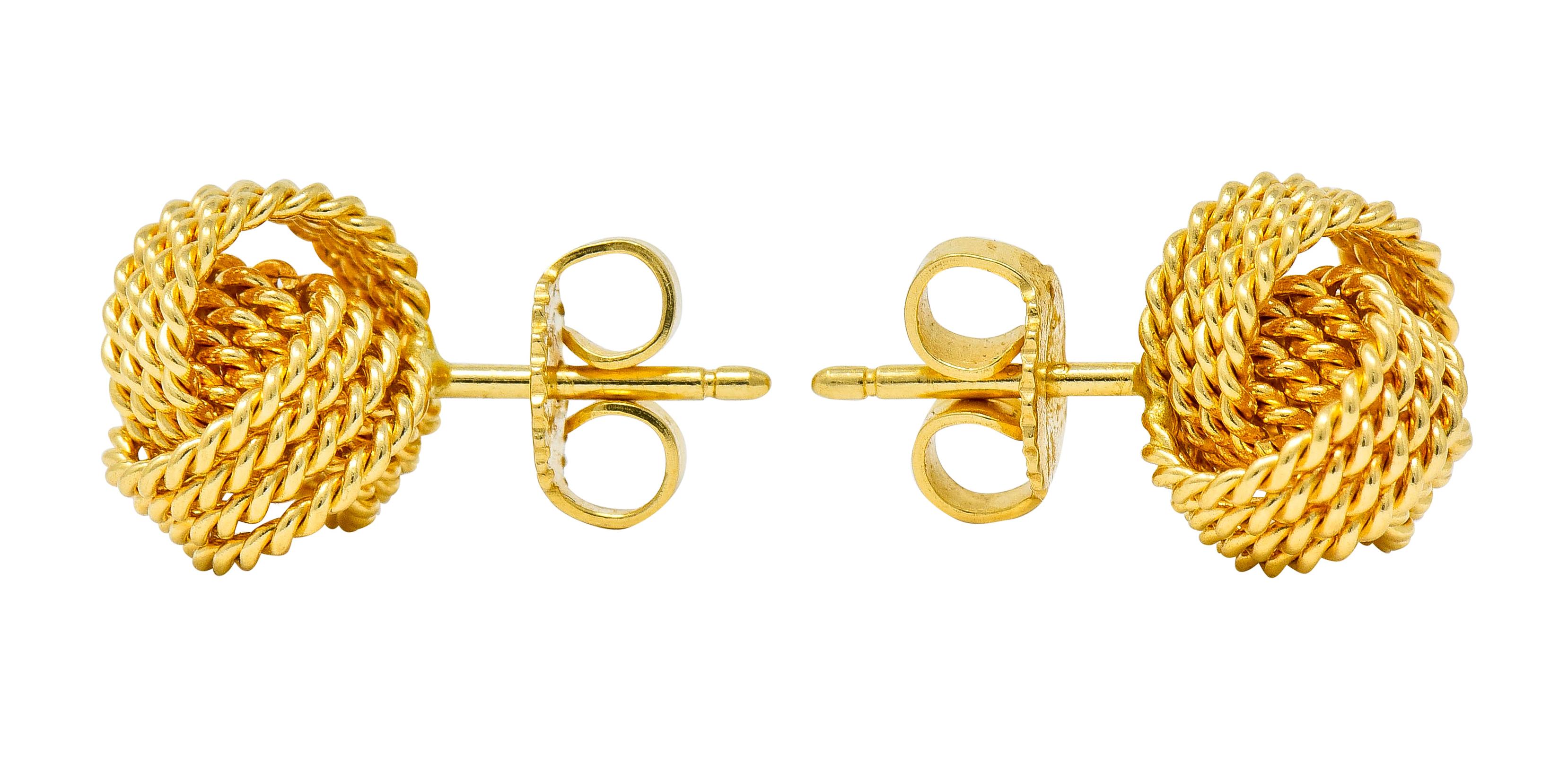 Stud style earrings designed as three circular loops comprised of a twisted rope motif

Intersecting as a love knot motif

From the Tiffany Twist collection, circa 2000s

Completed by posts and friction backs

Posts are signed T & Co. and stamped