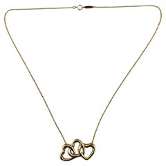 Tiffany 
Co. 18 Karat Yellow Gold Triple Open Heart Pendant Necklace #19526