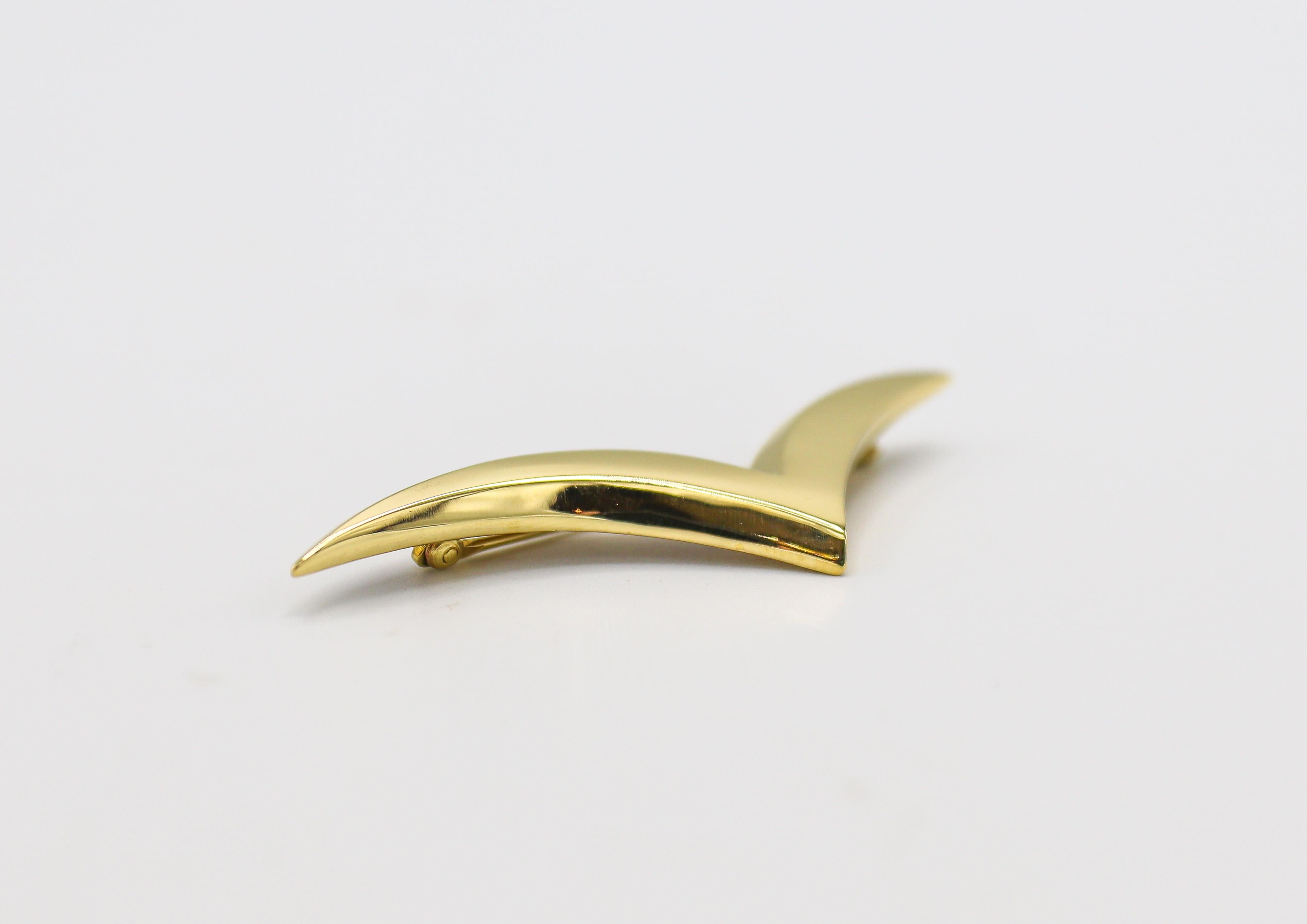 yellow brooch pin