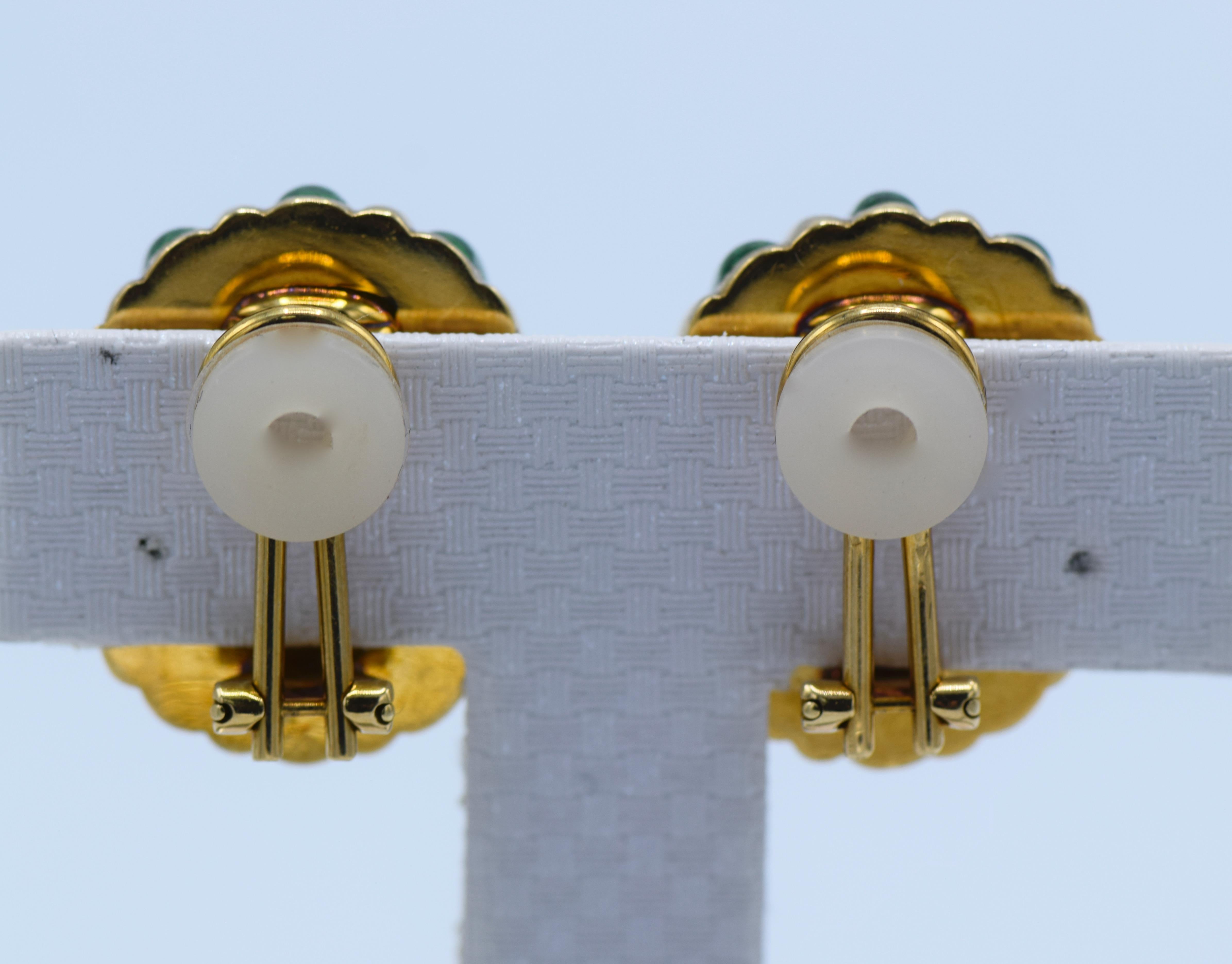 These Tiffany & Co clip on earrings are made of 18K Yellow Gold and striped with green enamel. Made in Italy, circa 1980, these earrings are a bold and colorful piece. 
