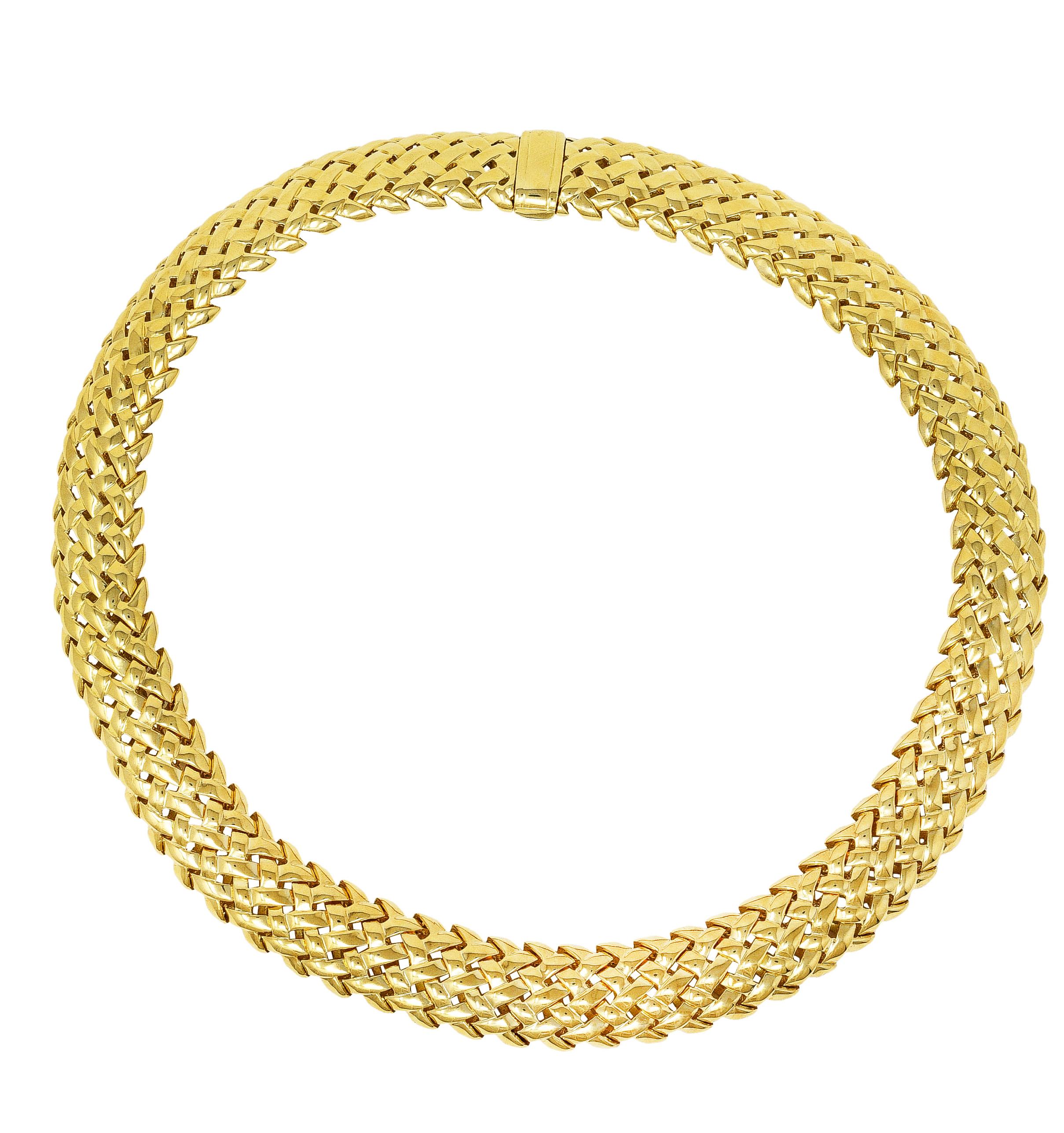 Collar style necklace comprised of articulated chevron links

Chevron links designed as basket-weave motif 

With high polish finish

Completed by hinged clasp 

Stamped 750 for 18 karat gold

Fully signed Tiffany & Co. 1989 

Length: 15 inches