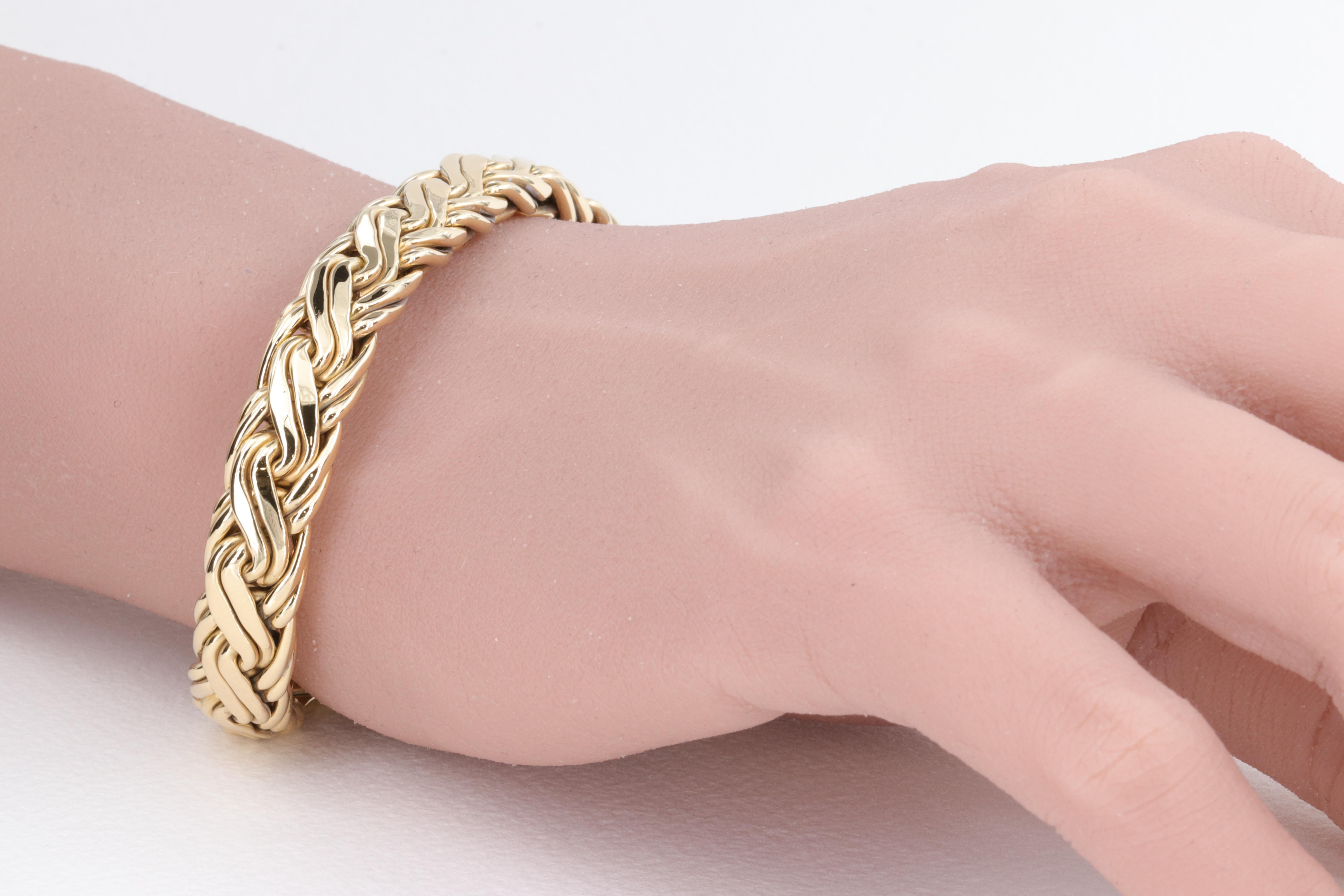 Tiffany & Co 18 Karat Yellow Gold Woven Wheat Bracelet 

7.5 Inch Length 

5.3mm Height 

9.5mm Wide

Stamped Tiffany & Co 750

35.1 Grams