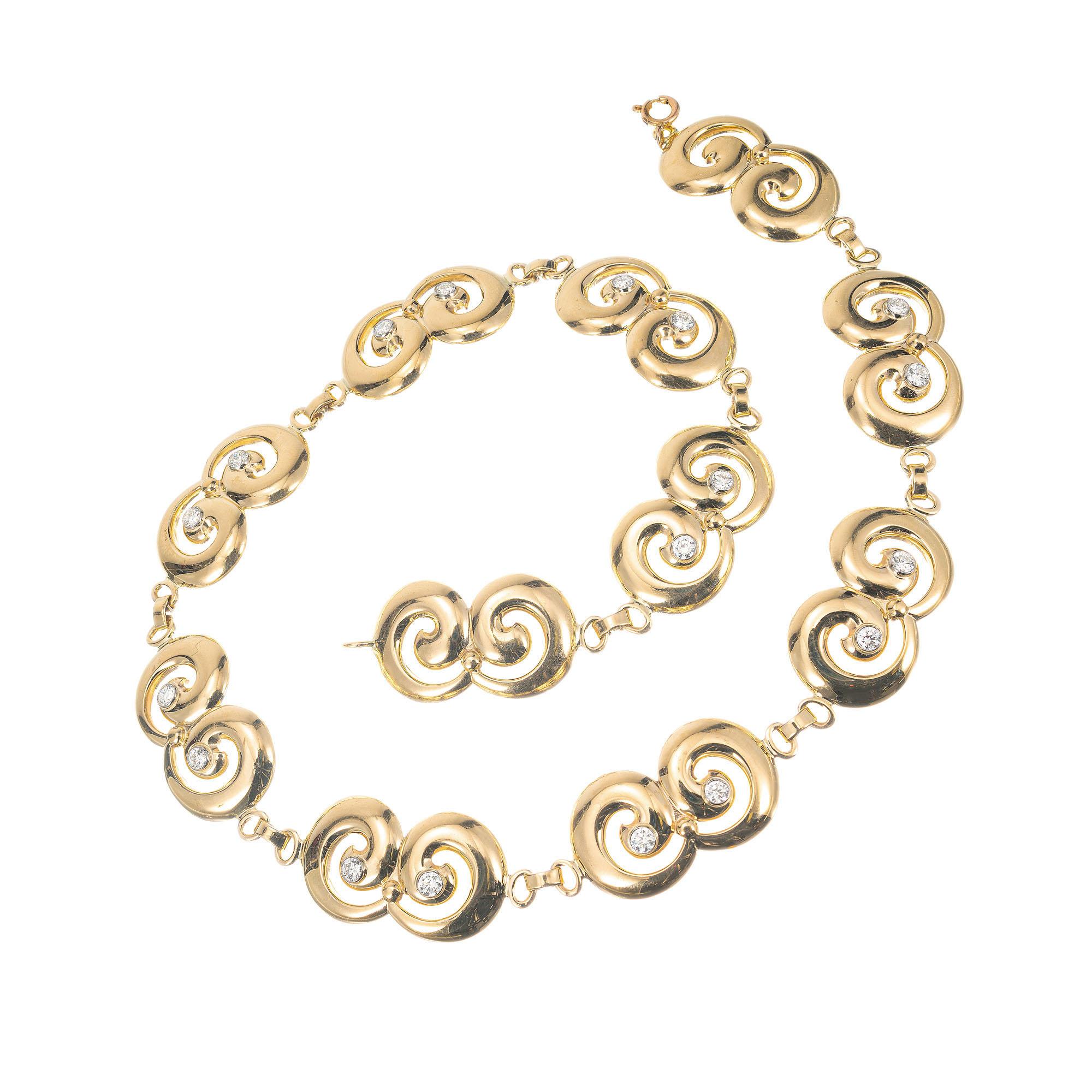 Tiffany & Co swirl link necklace in 14k yellow gold with 18 brilliant cut round tube set diamonds. 16.5 Inch length. 

18 brilliant cut diamonds, F VS approx. 1.80cts
14k yellow gold 
Platinum 
Stamped: 14k
Hallmark: Tiffany & Co
60.6 grams
Total